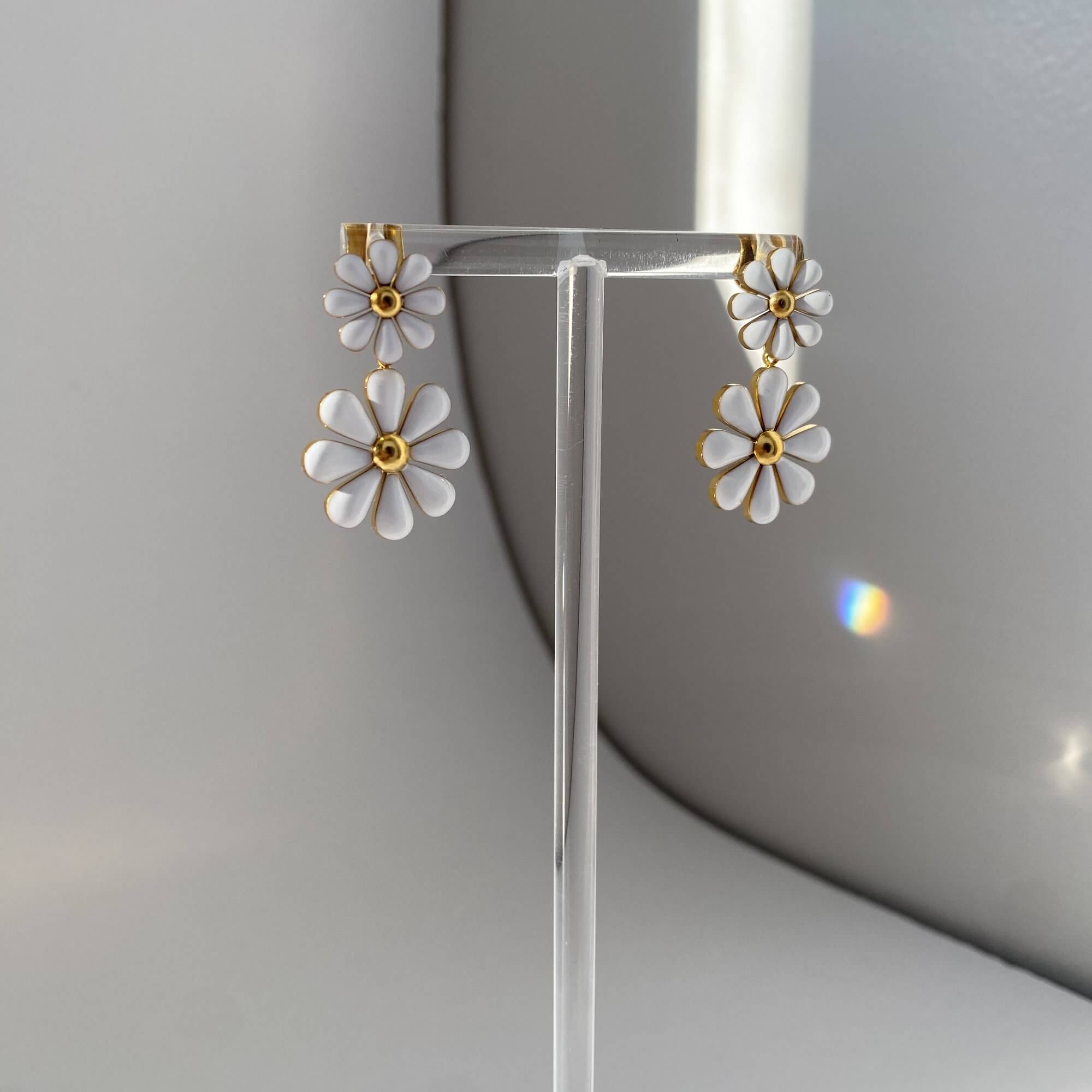Side profile of KendyR daisy drop earrings by Kampy Designs, revealing the petal layering and gold-tone hook backing.