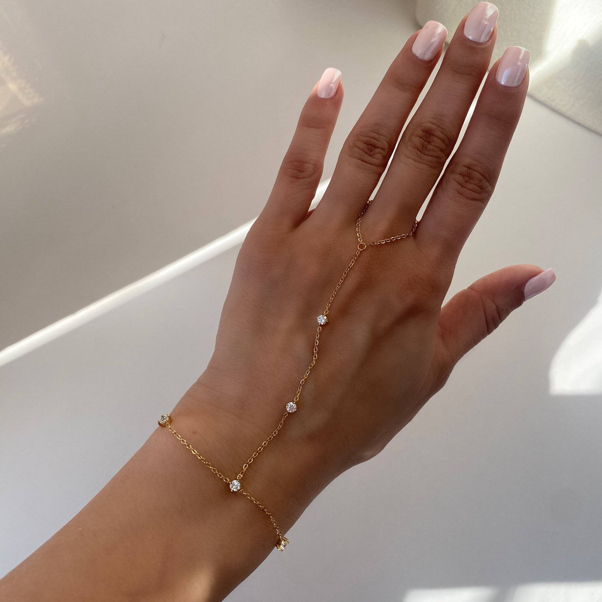 KetsiyaB diamond hand chain bracelet by Kampy Designs, styled on model’s wrist to display its elegant connection between ring and bracelet.
