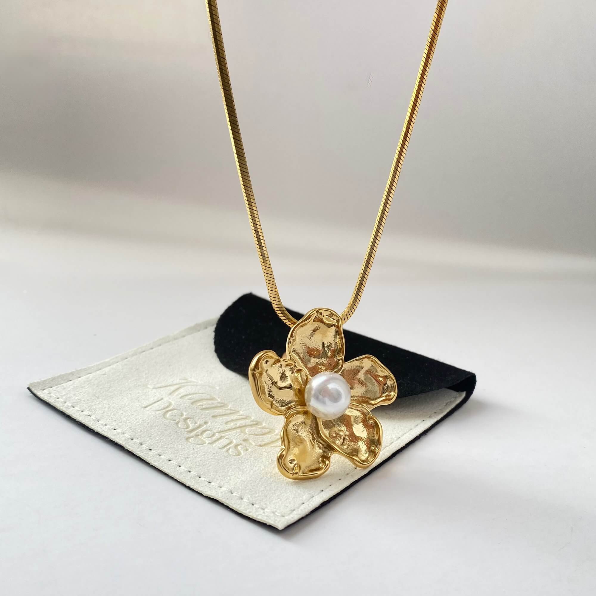 Angled shot of the Kloran floral pearl pendant necklace by Kampy Designs, emphasizing the pendant’s dimensional details and natural elegance.