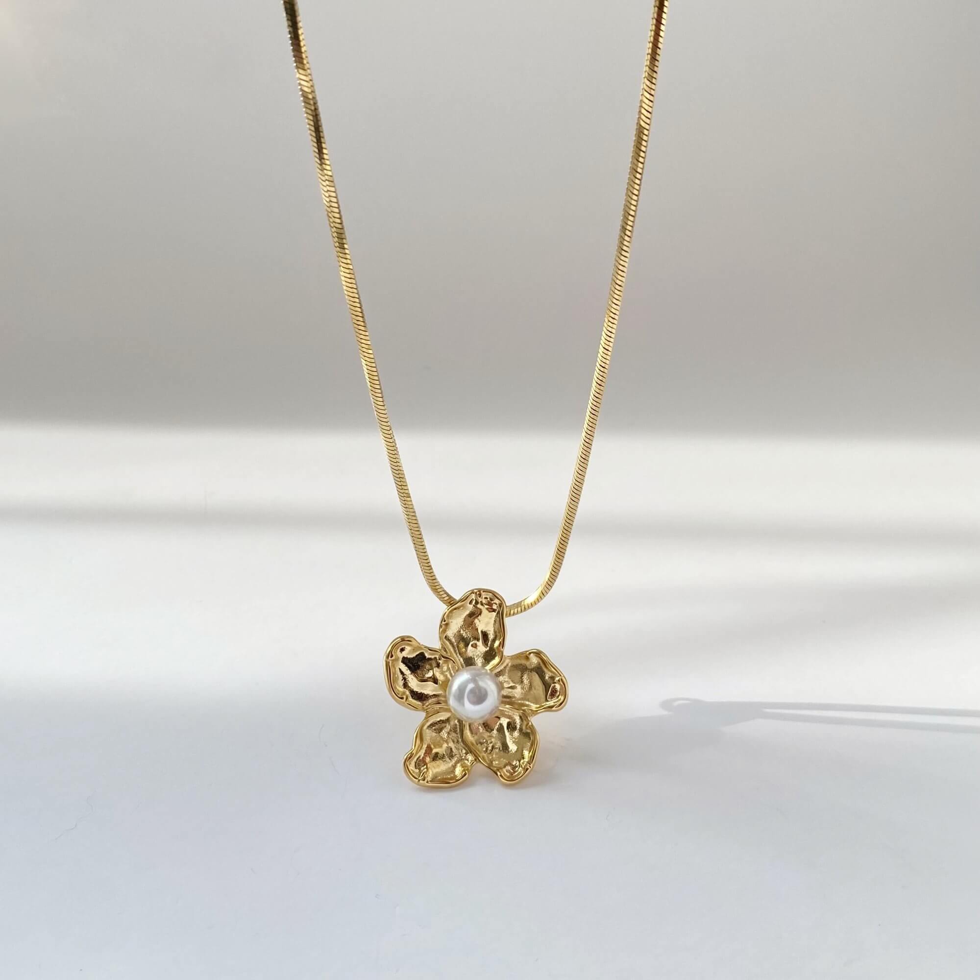 Front-facing view of the Kloran floral pearl pendant necklace by Kampy Designs, showcasing the full charm of its flower-inspired pendant and elegant chain.