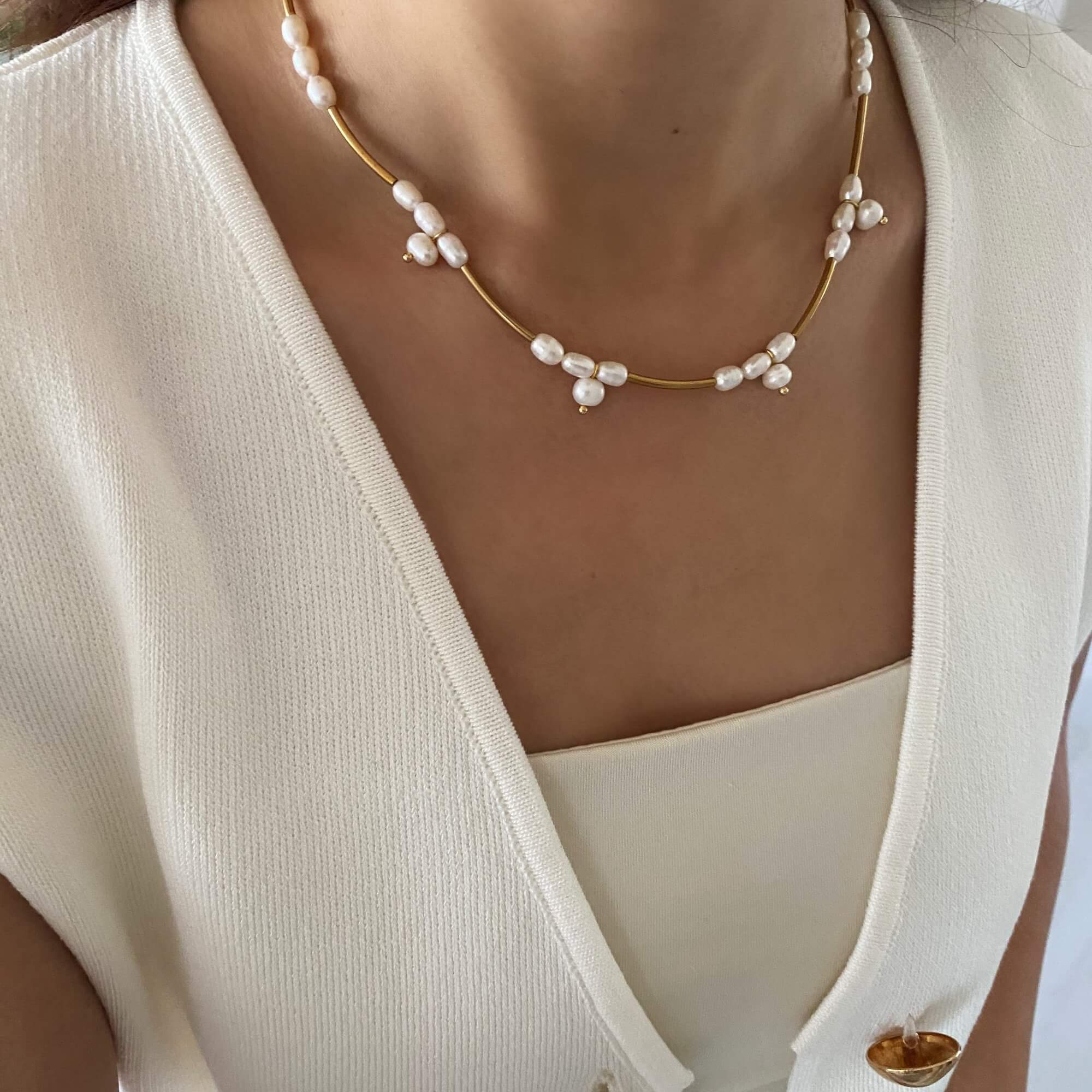 Angled view of the KlamN freshwater pearl boho chain necklace by Kampy Designs, highlighting its intricate link design and organic pearl elements.