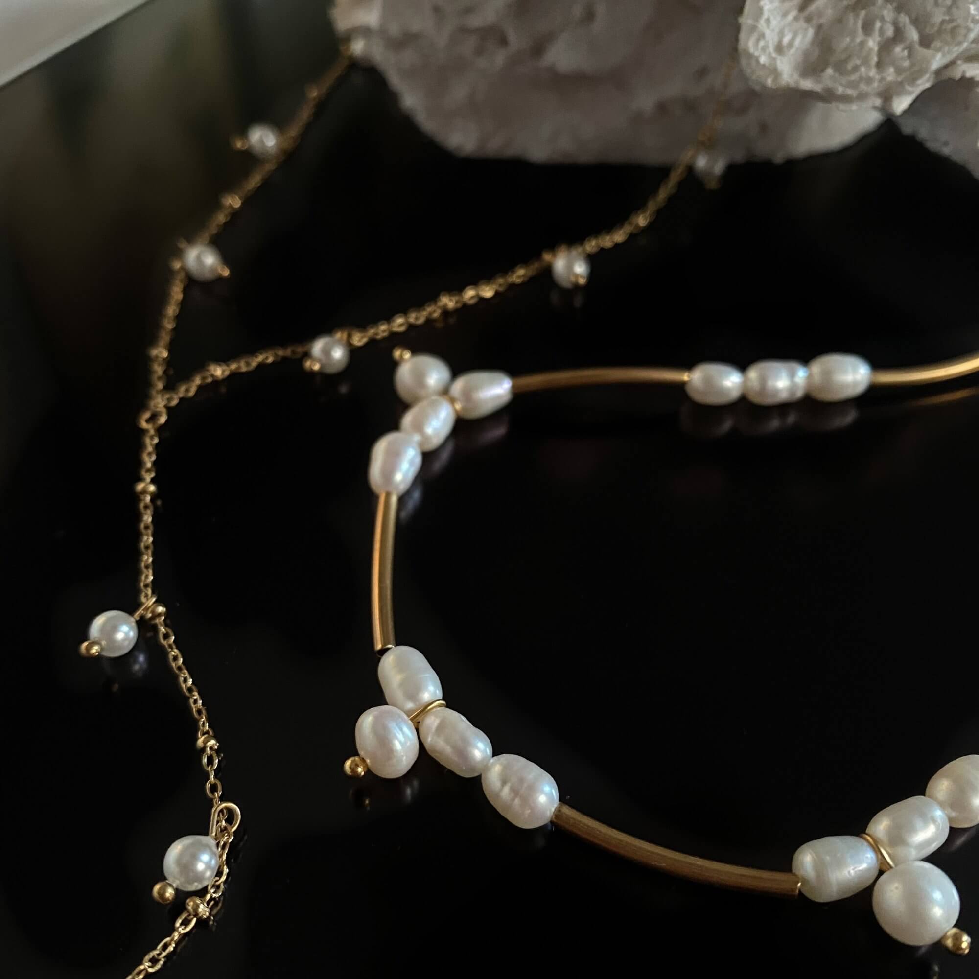 Close-up of the KlamN freshwater pearl boho chain necklace by Kampy Designs, capturing the lustrous pearl details and refined gold chain.