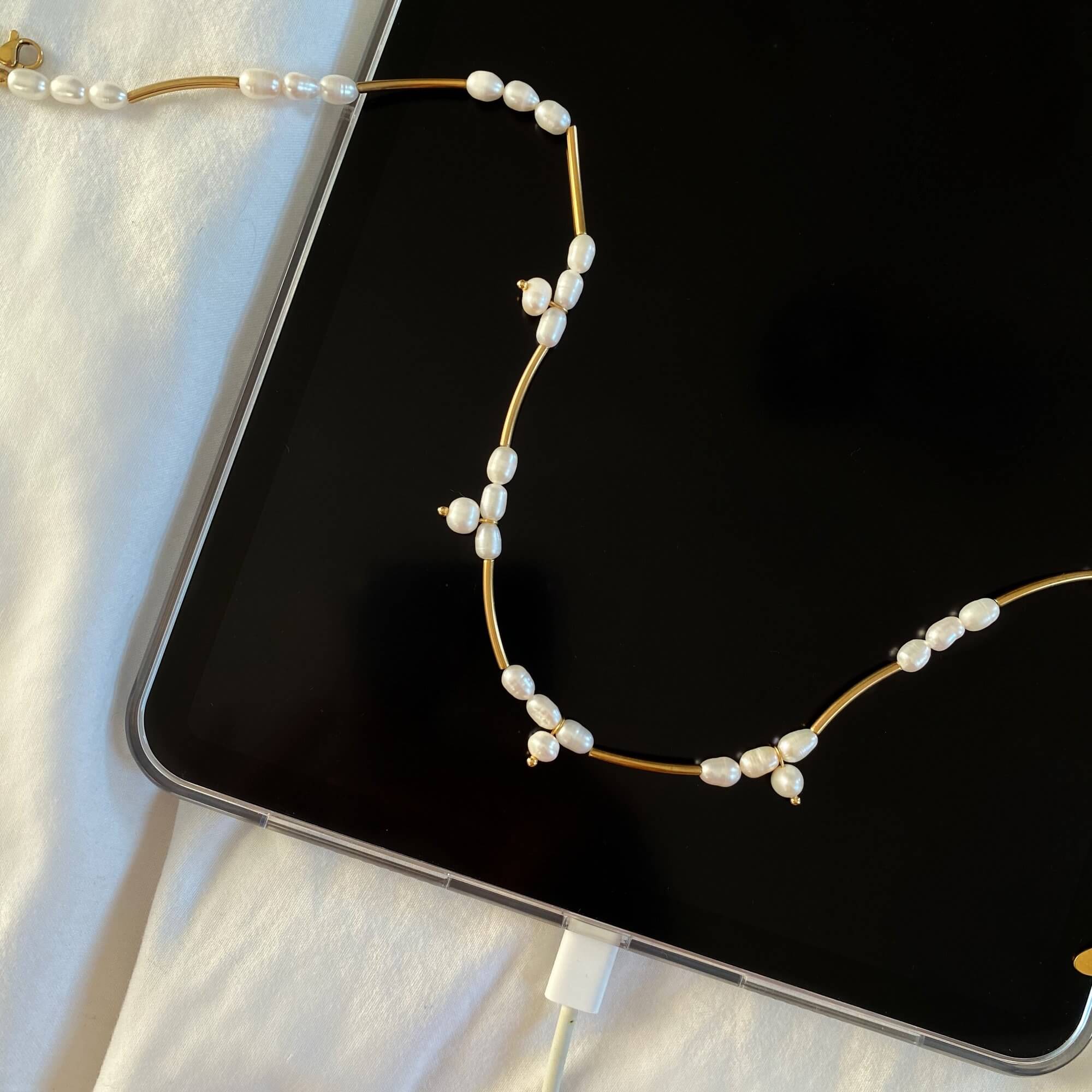 Front view of the KlamN freshwater pearl boho chain necklace by Kampy Designs, displaying its elegant pearl embellishments and lightweight chain structure.