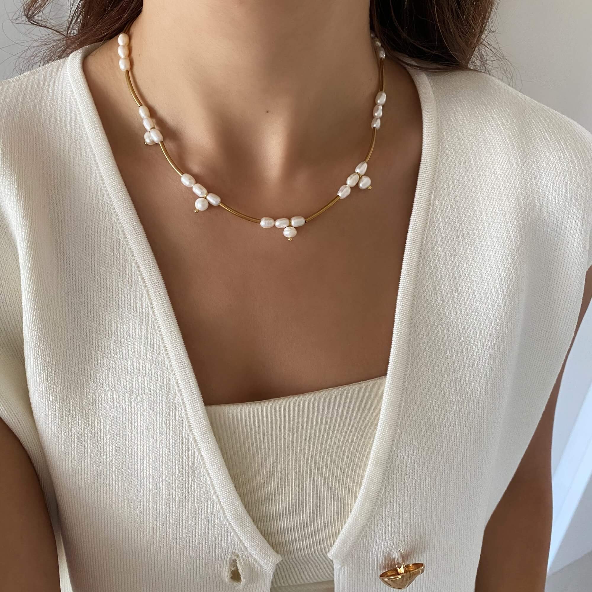 Side view of the KlamN freshwater pearl boho chain necklace by Kampy Designs, showcasing its delicate chain and natural pearl accents.