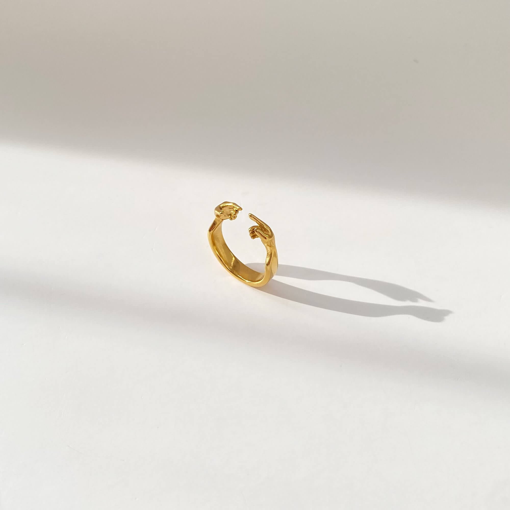 Angled view of the Keor hand gesture ring by Kampy Designs, emphasizing the delicate finger detail and unique artistic flair.