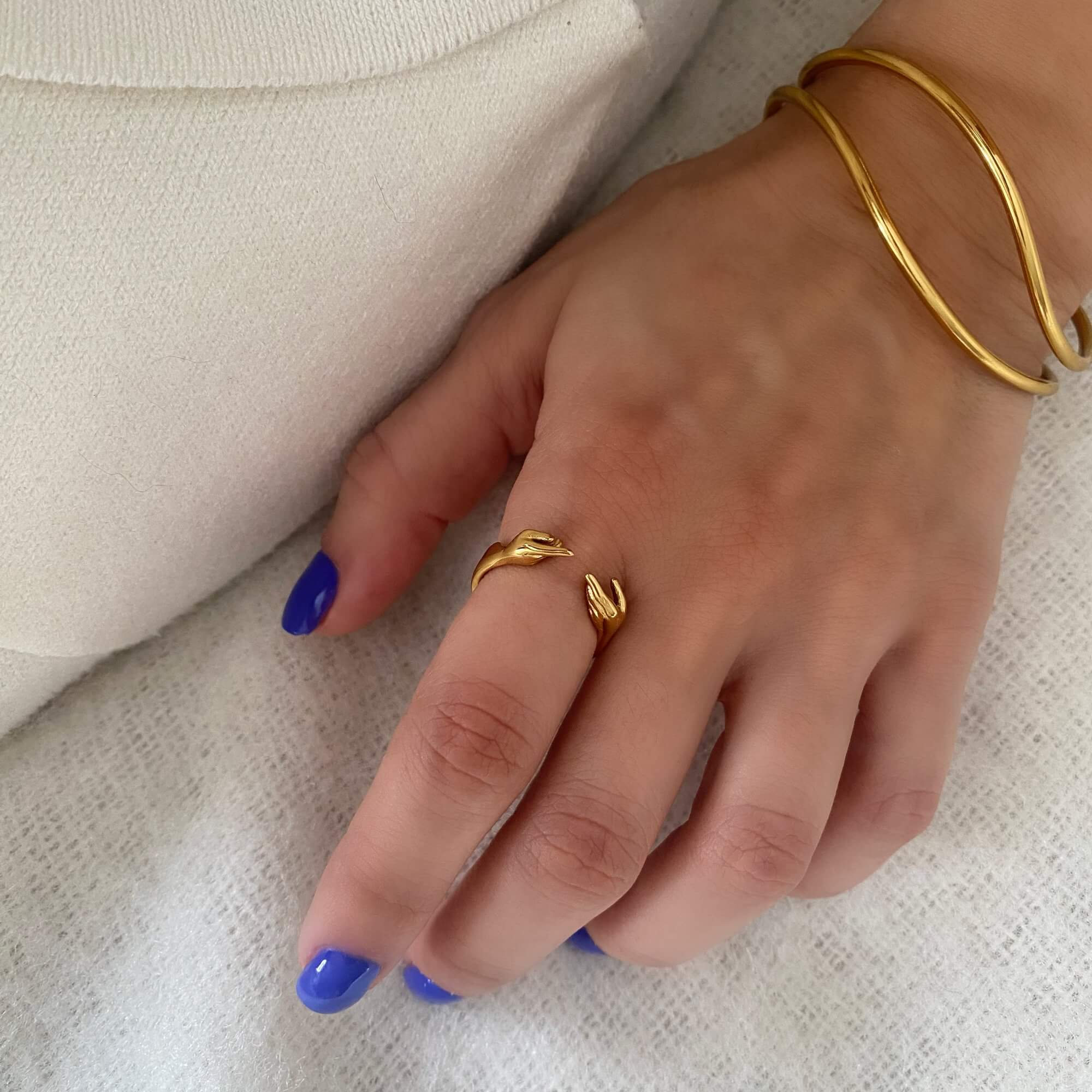 The Keor hand gesture ring by Kampy Designs, worn on model’s hand from an angled perspective, showcasing its artistic and expressive design.