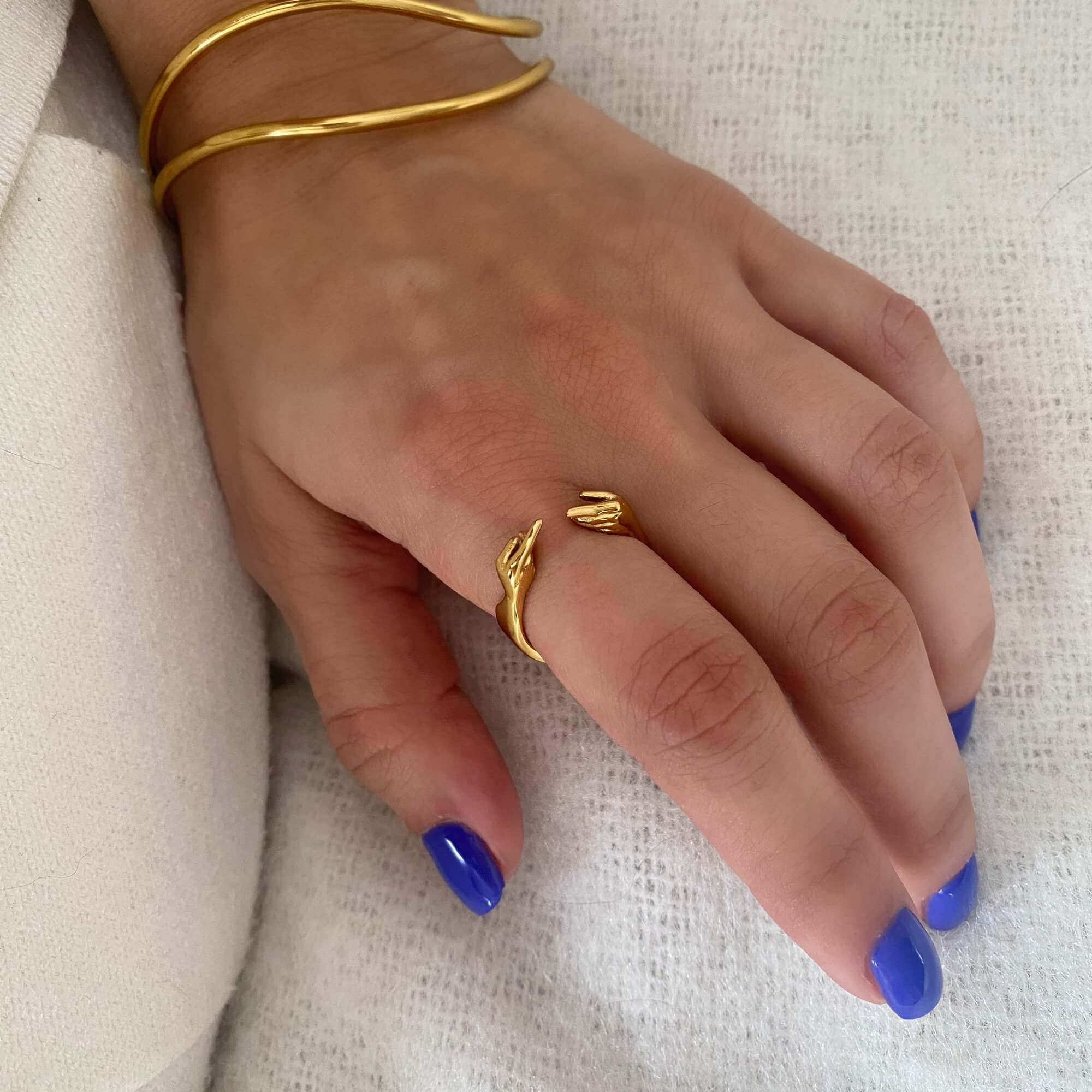 The Keor hand gesture ring by Kampy Designs, styled on the model’s hand to highlight its symbolic form and sculptural look.