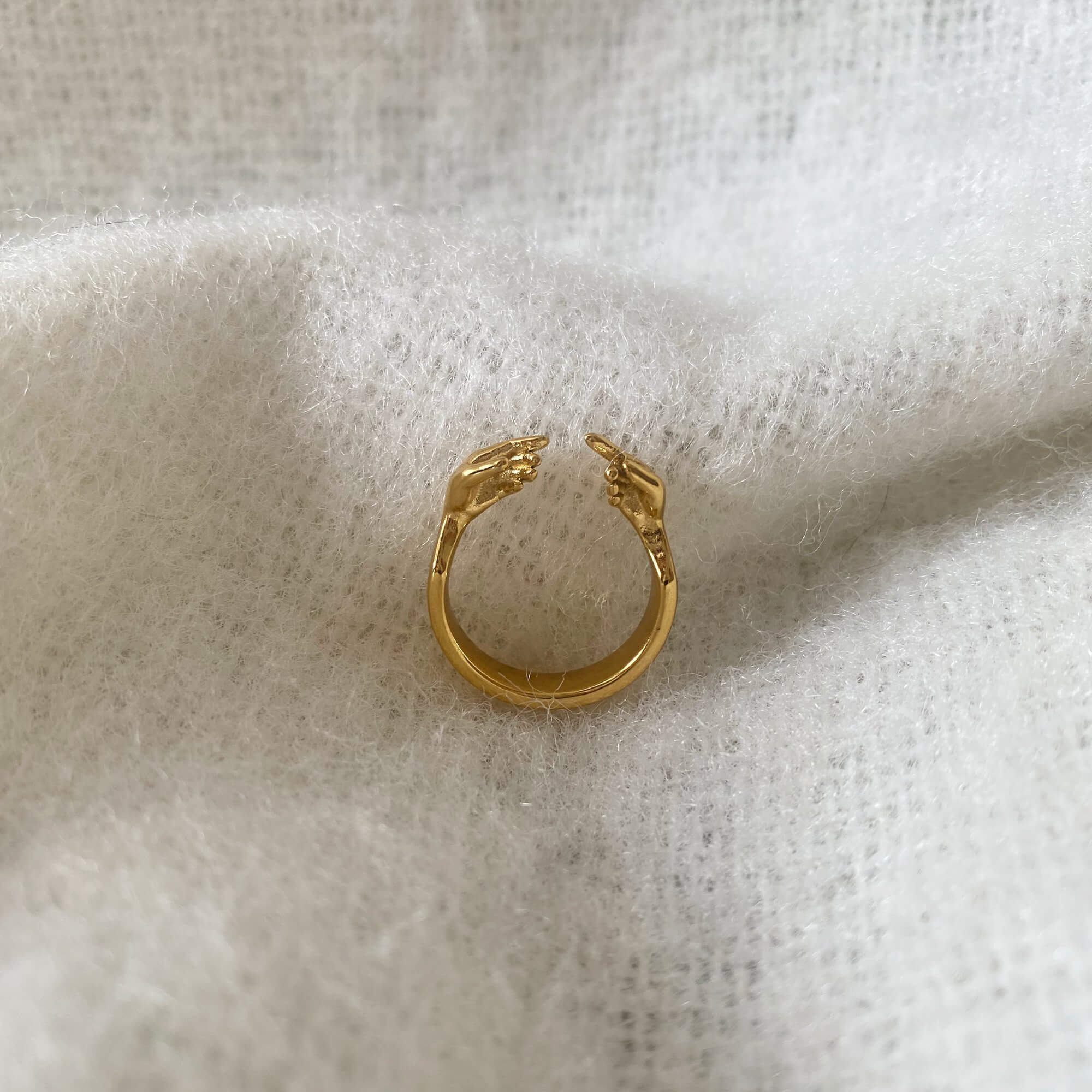 Side view of the Keor hand gesture ring by Kampy Designs, showing the detailed contours and high-polish gold finish.