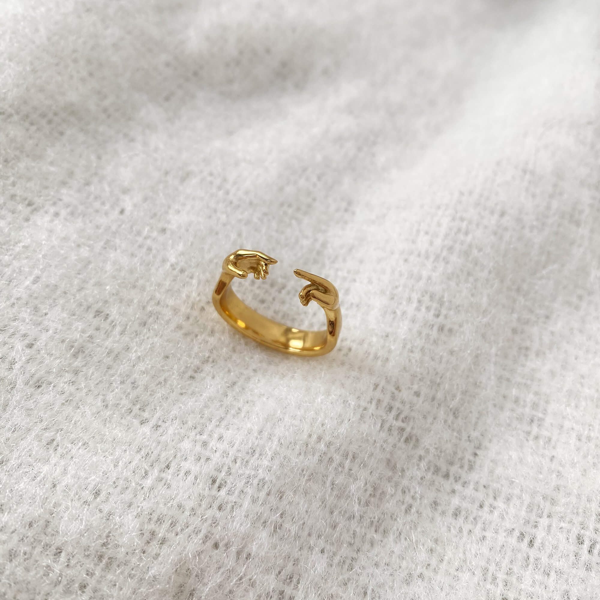 Top view of the Keor hand gesture ring by Kampy Designs, capturing its shape and minimalist band in a flat profile.
