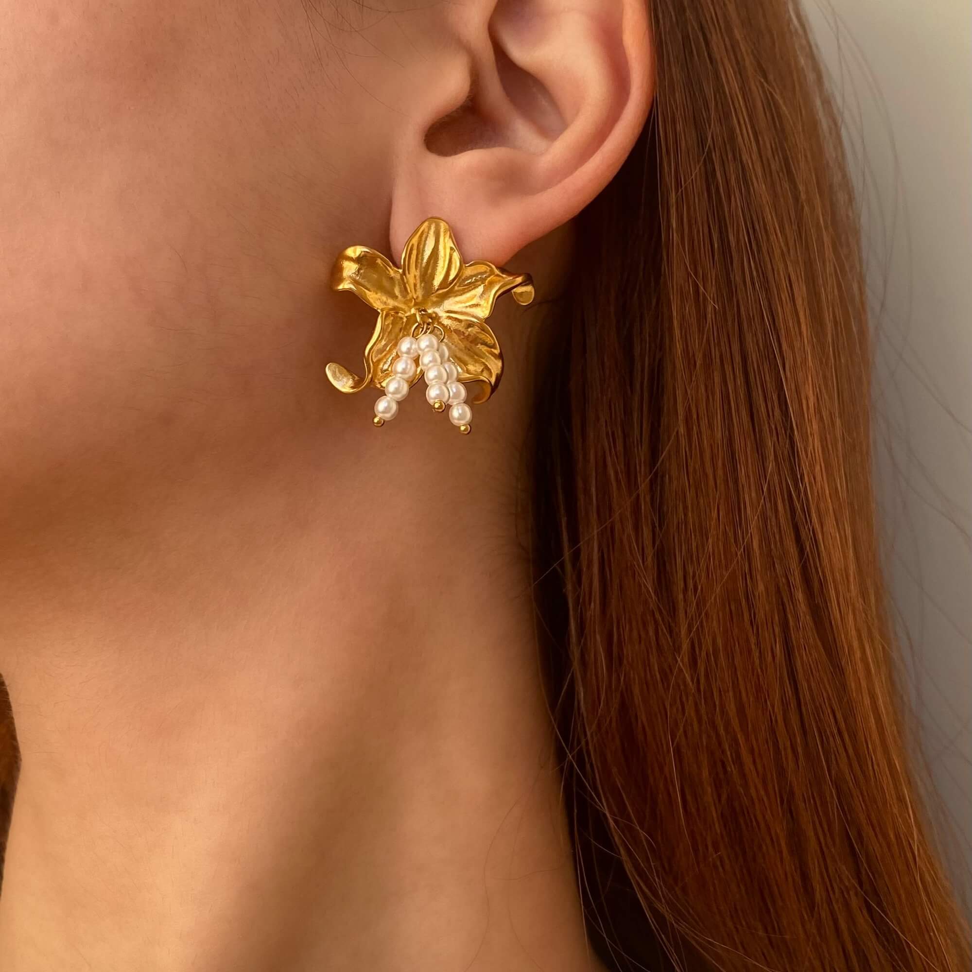 Close-up of Kawaiie hibiscus flower stud earrings by Kampy Designs, showcasing the enamel finish and delicate floral craftsmanship.