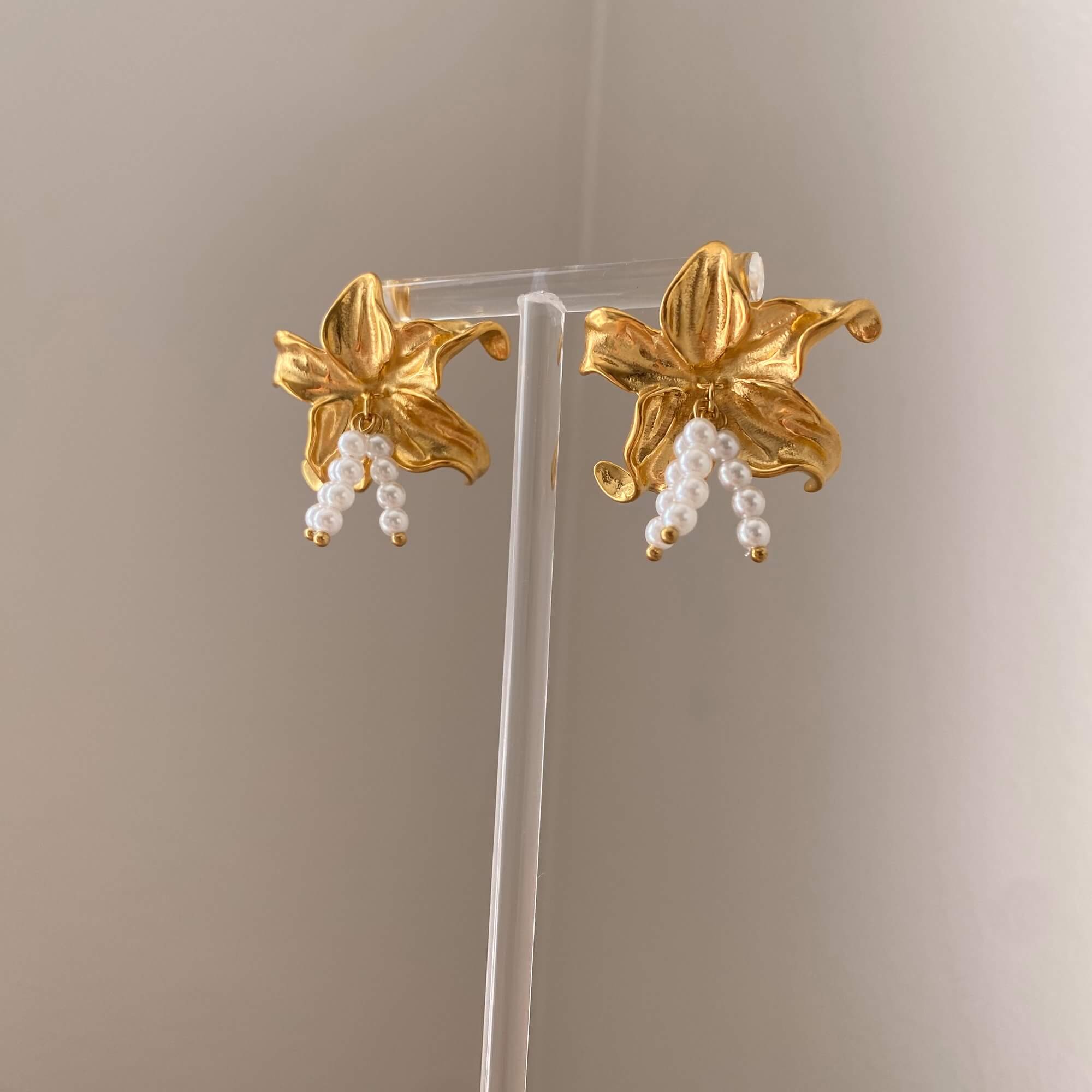 Front-facing view of the Kawaiie hibiscus flower stud earrings by Kampy Designs, showing the complete floral form with golden backing.