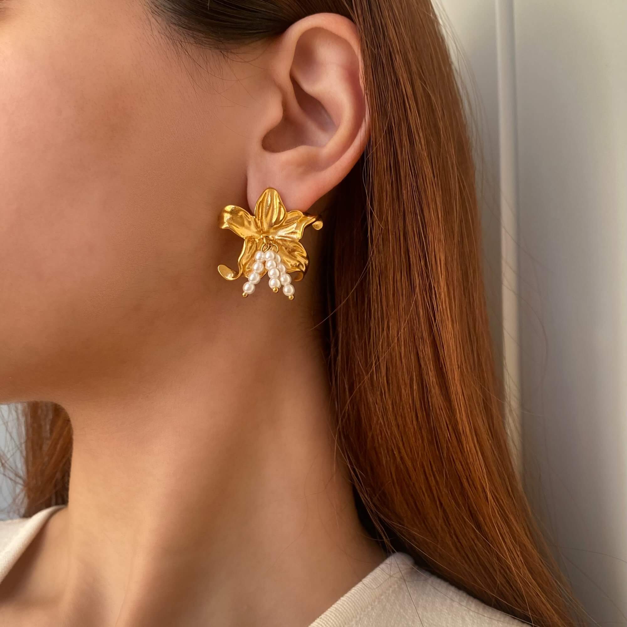 Hibiscus flower stud earrings Kawaiie by Kampy Designs, worn on model’s ear to highlight floral detail and delicate sizing.