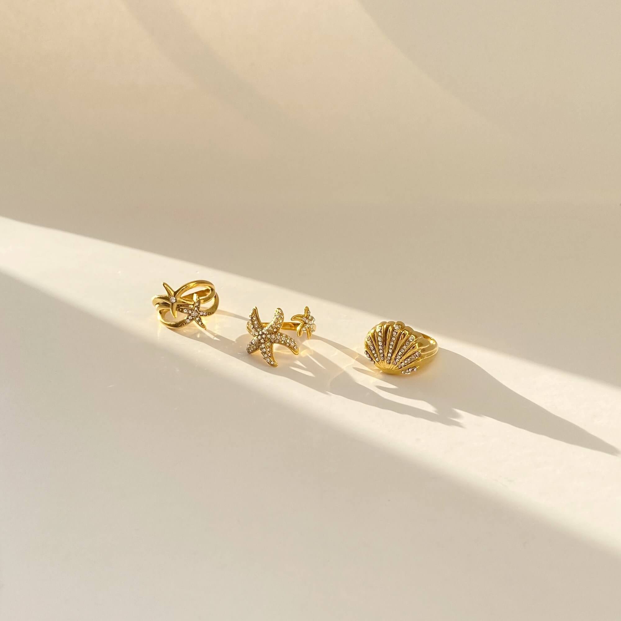 Layered view of the Ocean Ring Set by Kampy Designs, worn together to create a multi-ring coastal look.