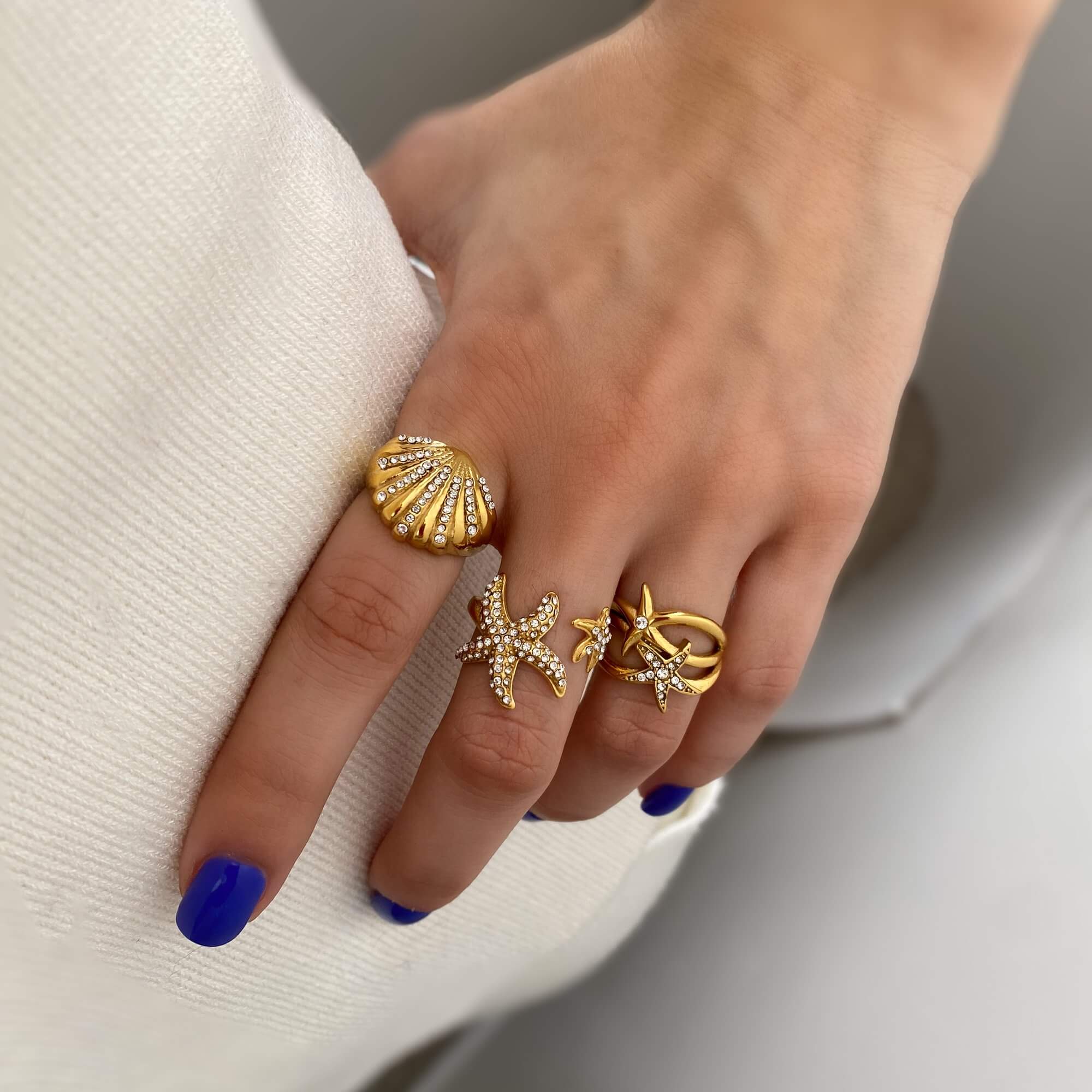 Close-up of Ocean Ring Set Design A from Kampy Designs, showcasing its sea-inspired detailing and textured gold band
