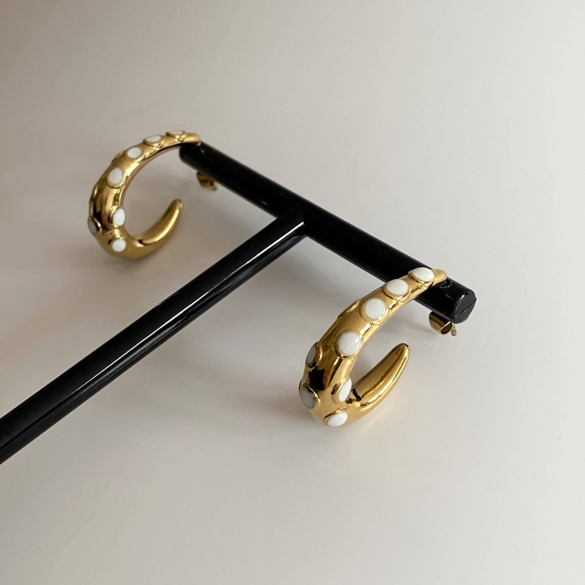 Top view of the KoctiE octopus tentacle gold hoop earring by Kampy Designs, displaying its bold and artistic hoop structure.