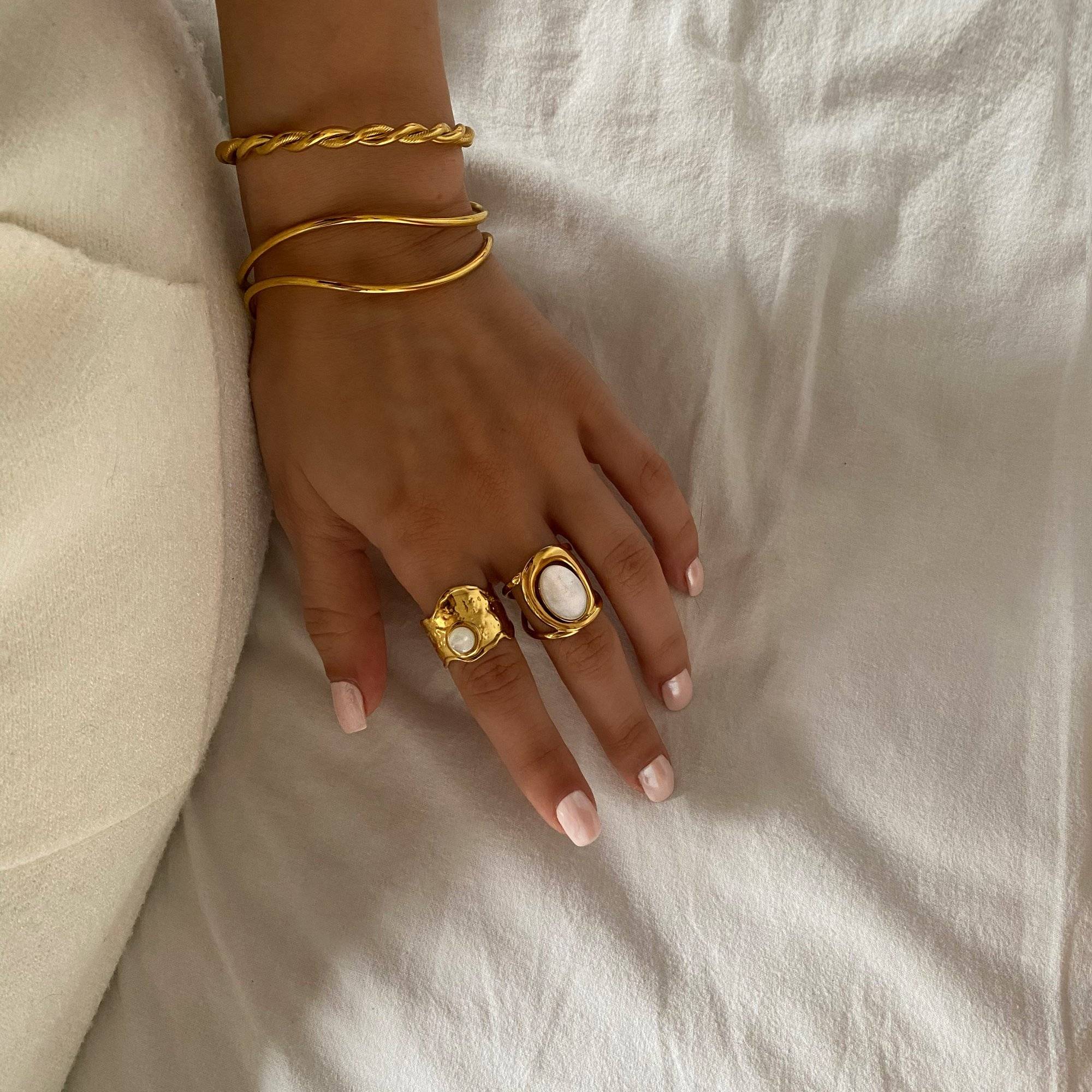 Styled display of Kennar opal hammered ring by Kampy Designs, laid against a soft neutral background for a modern minimalist vibe.