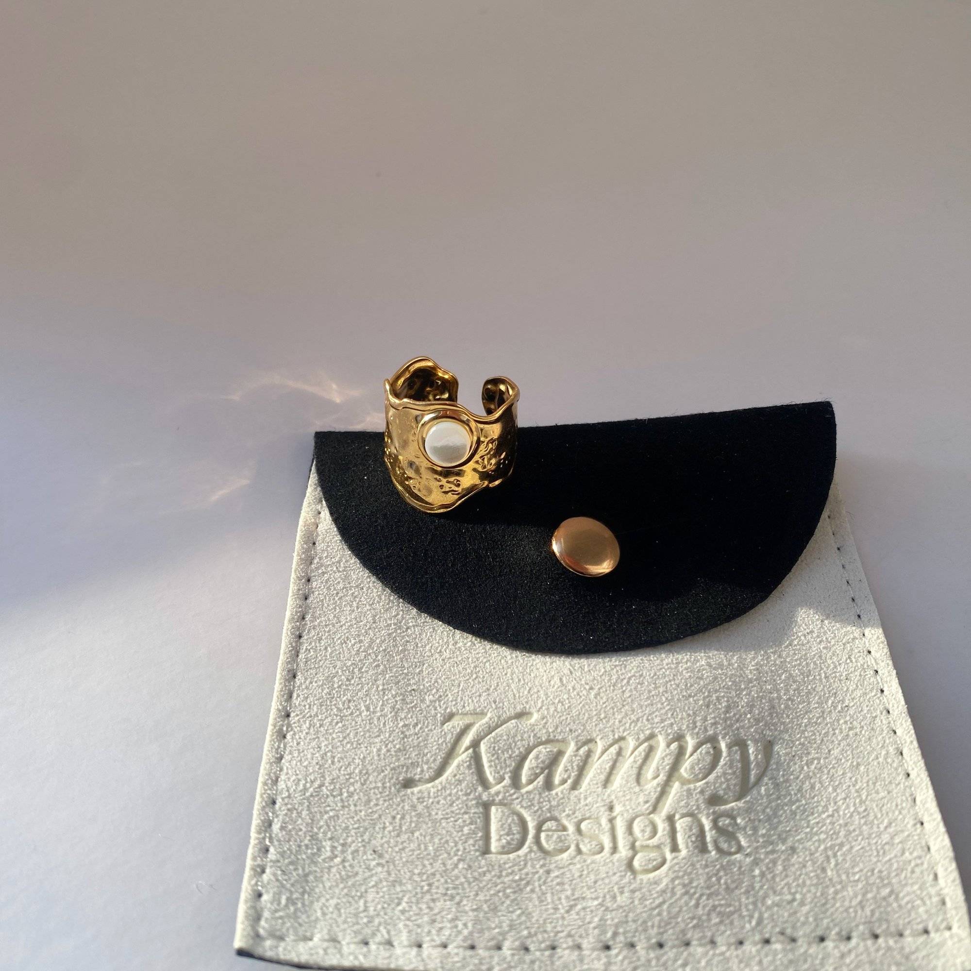 Kennar opal hammered ring by Kampy Designs, styled on model for an elegant and refined editorial jewelry look.