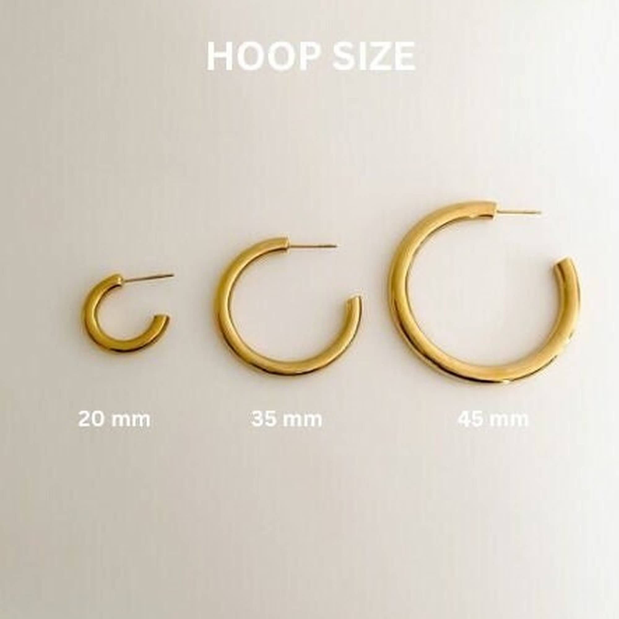 Size chart for the KarlE open circle hoop stud earrings by Kampy Designs, comparing small and medium sizes for a perfect fit.
