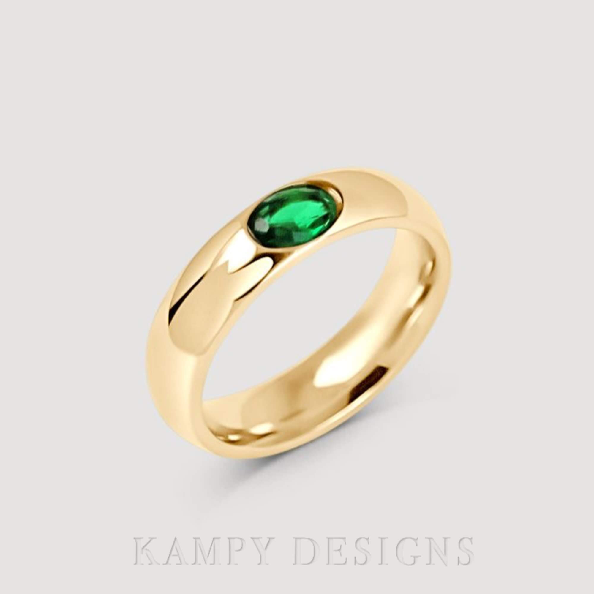 Top view of the KimmyR oval diamond cigar band ring by Kampy Designs, displaying its smooth, wide band and radiant diamond centerpiece.