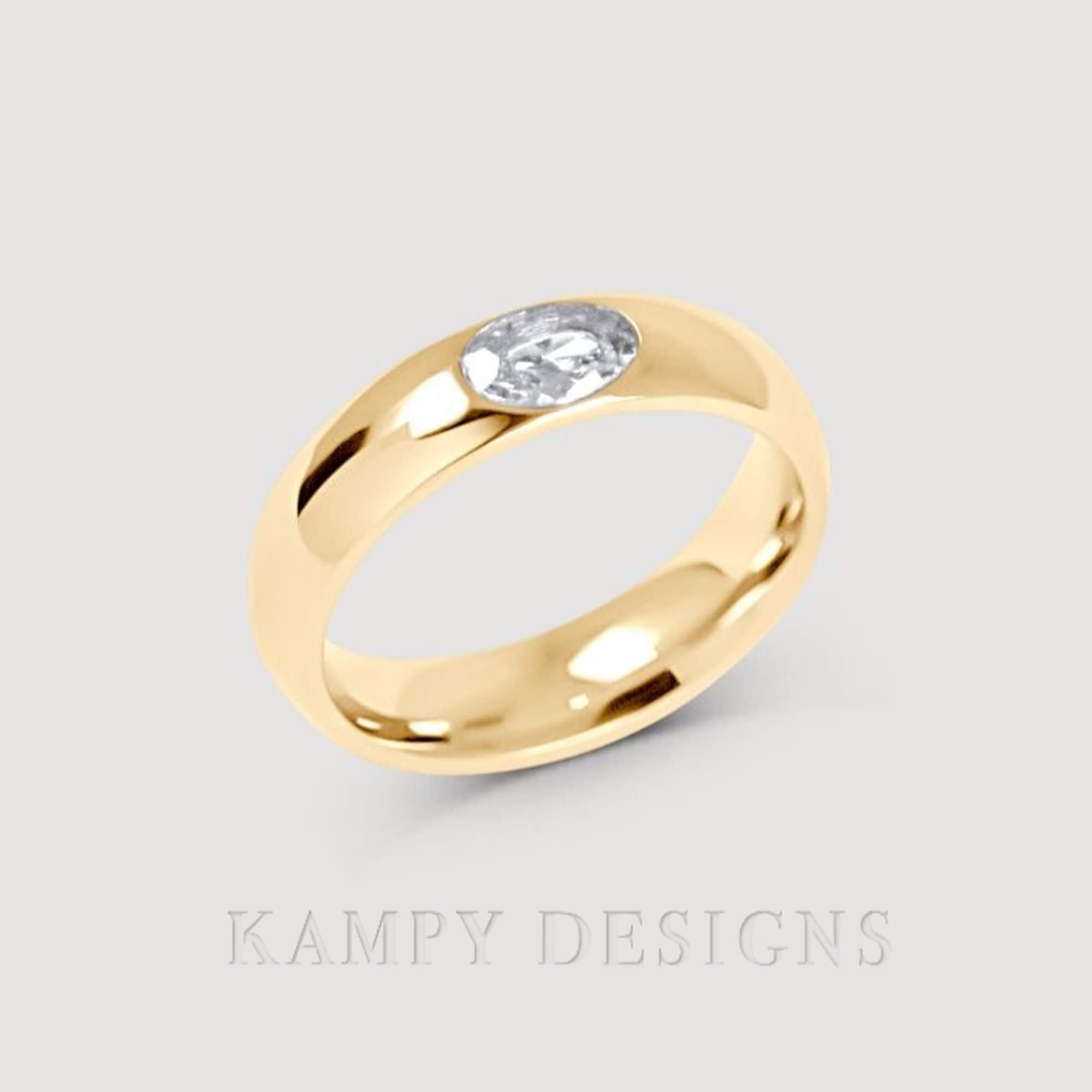 Alternative top view of the KimmyR oval diamond cigar band ring by Kampy Designs, emphasizing its luxurious finish and bold design.