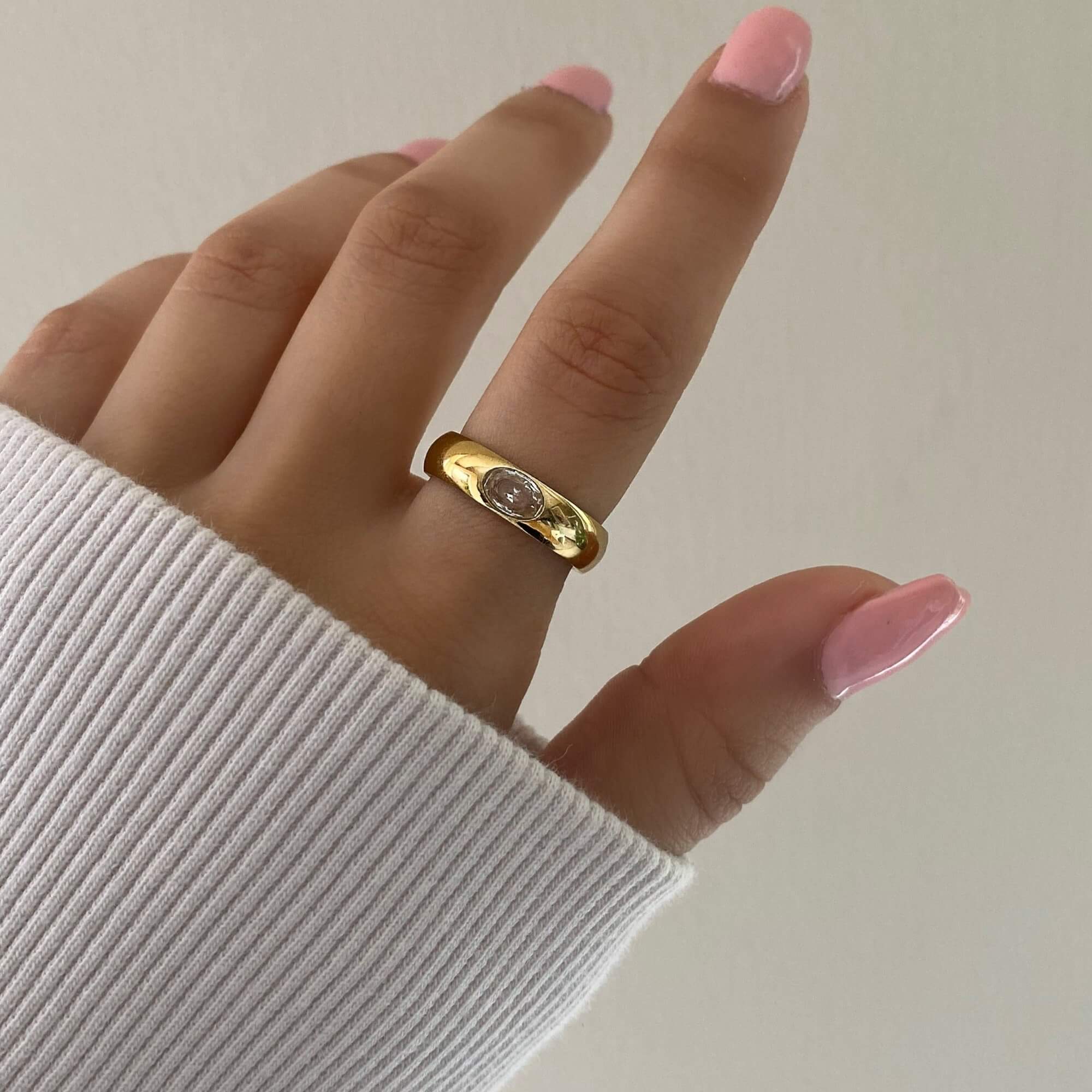 The KimmyR oval diamond cigar band ring by Kampy Designs, elegantly worn to showcase its bold and sophisticated design.