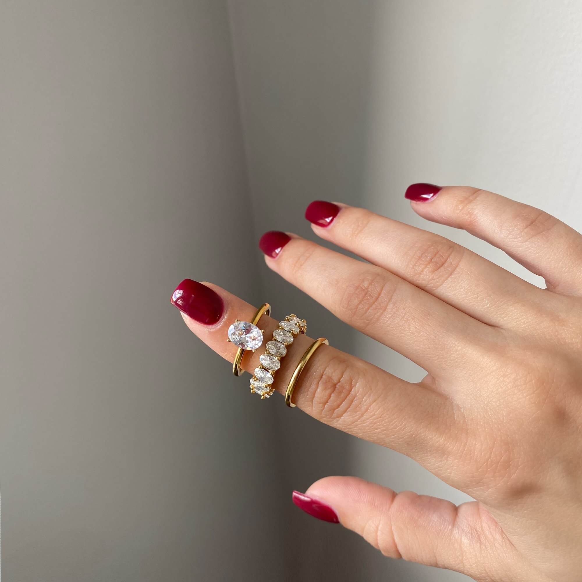 Set view of the KastielR oval diamond eternity ring by Kampy Designs, arranged in a collection to showcase its timeless beauty and versatility.