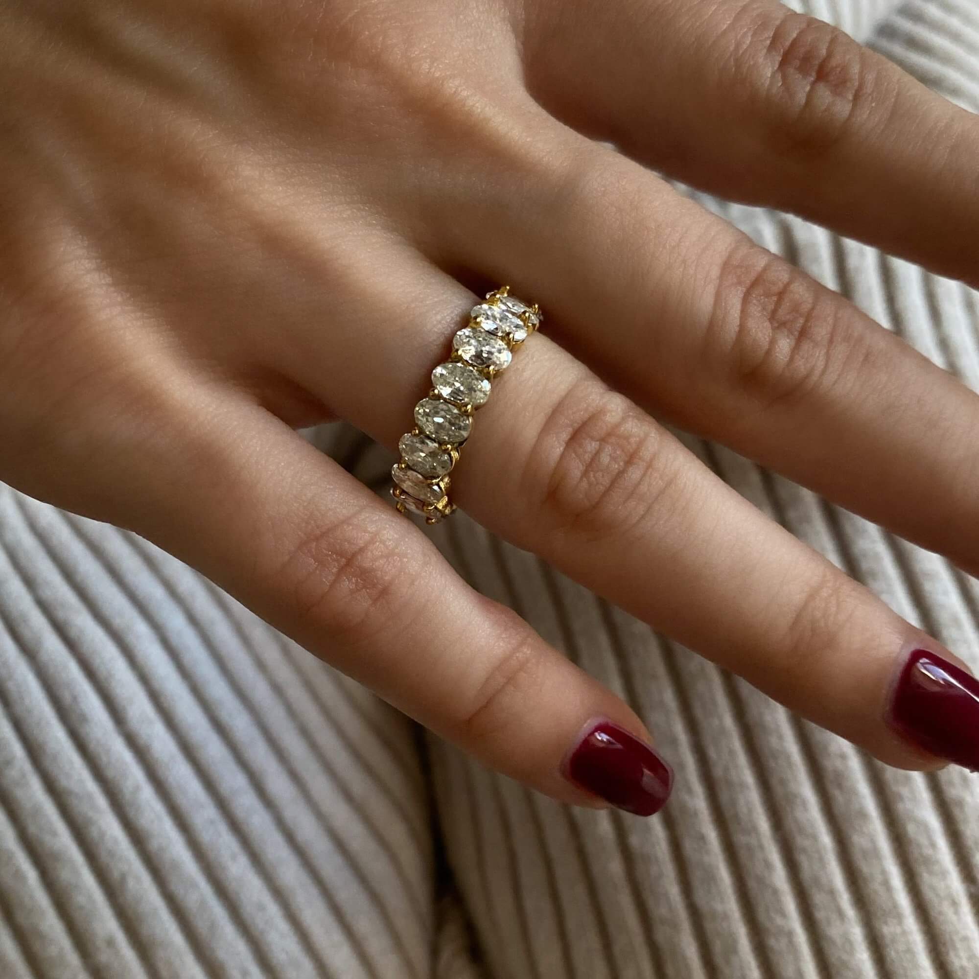 Side view of the KastielR oval diamond eternity ring by Kampy Designs, capturing its delicate band and elegant diamond settings.