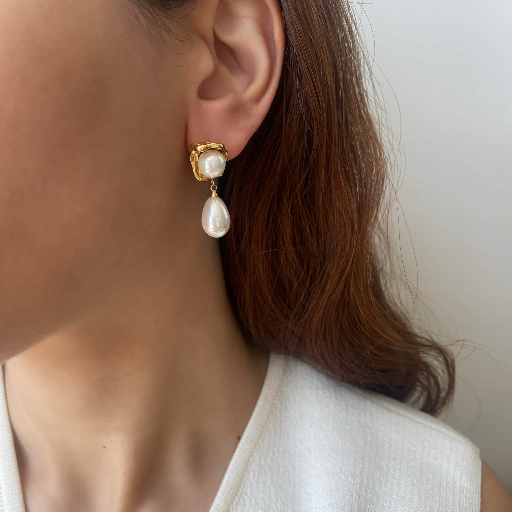 KearyE oyster pearl dangle earrings by Kampy Designs, styled on model’s ear to showcase their ocean-inspired elegance and iridescent charm.