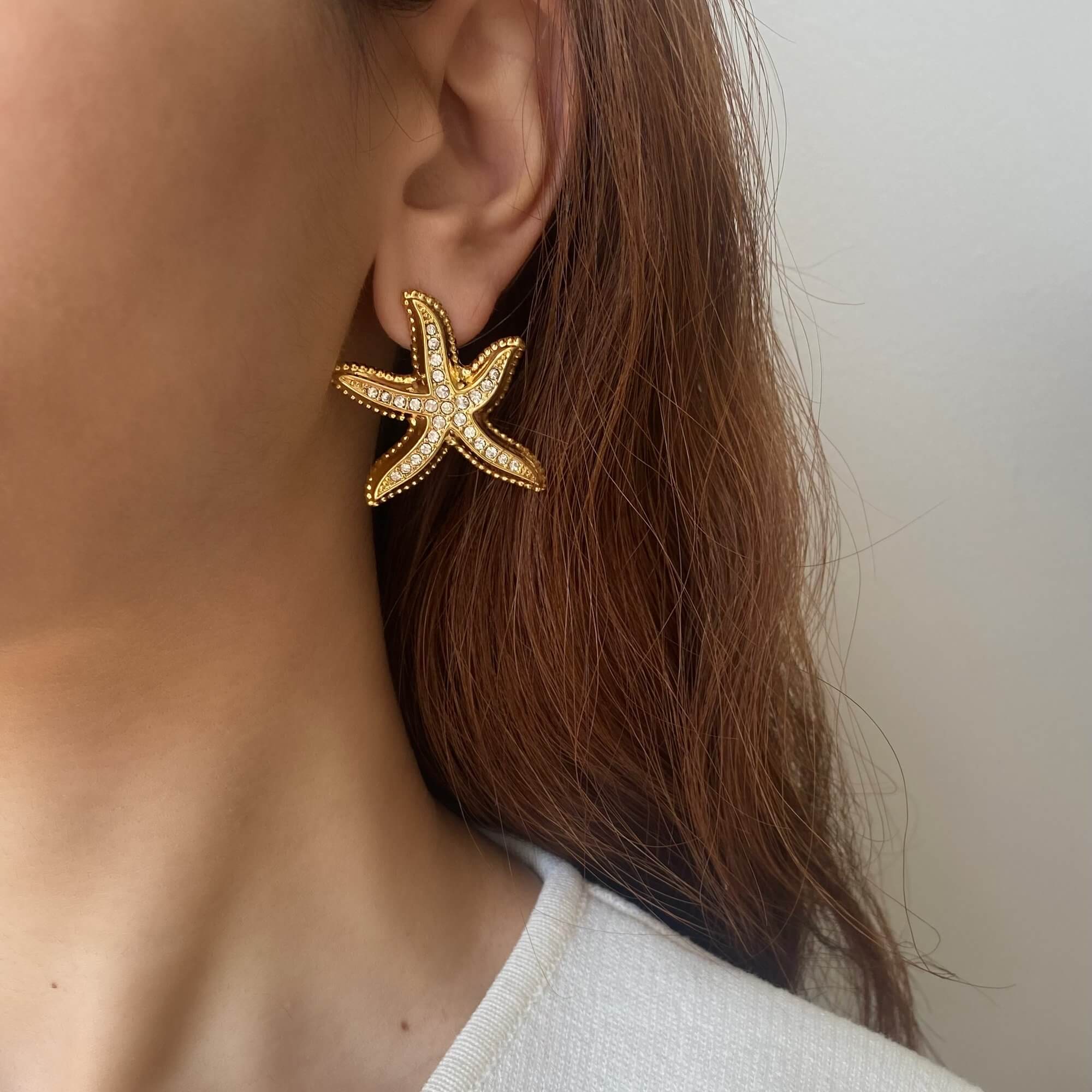 KariyaE pavé starfish statement earrings by Kampy Designs, styled on model’s ear to showcase their oceanic elegance and sculptural flair.