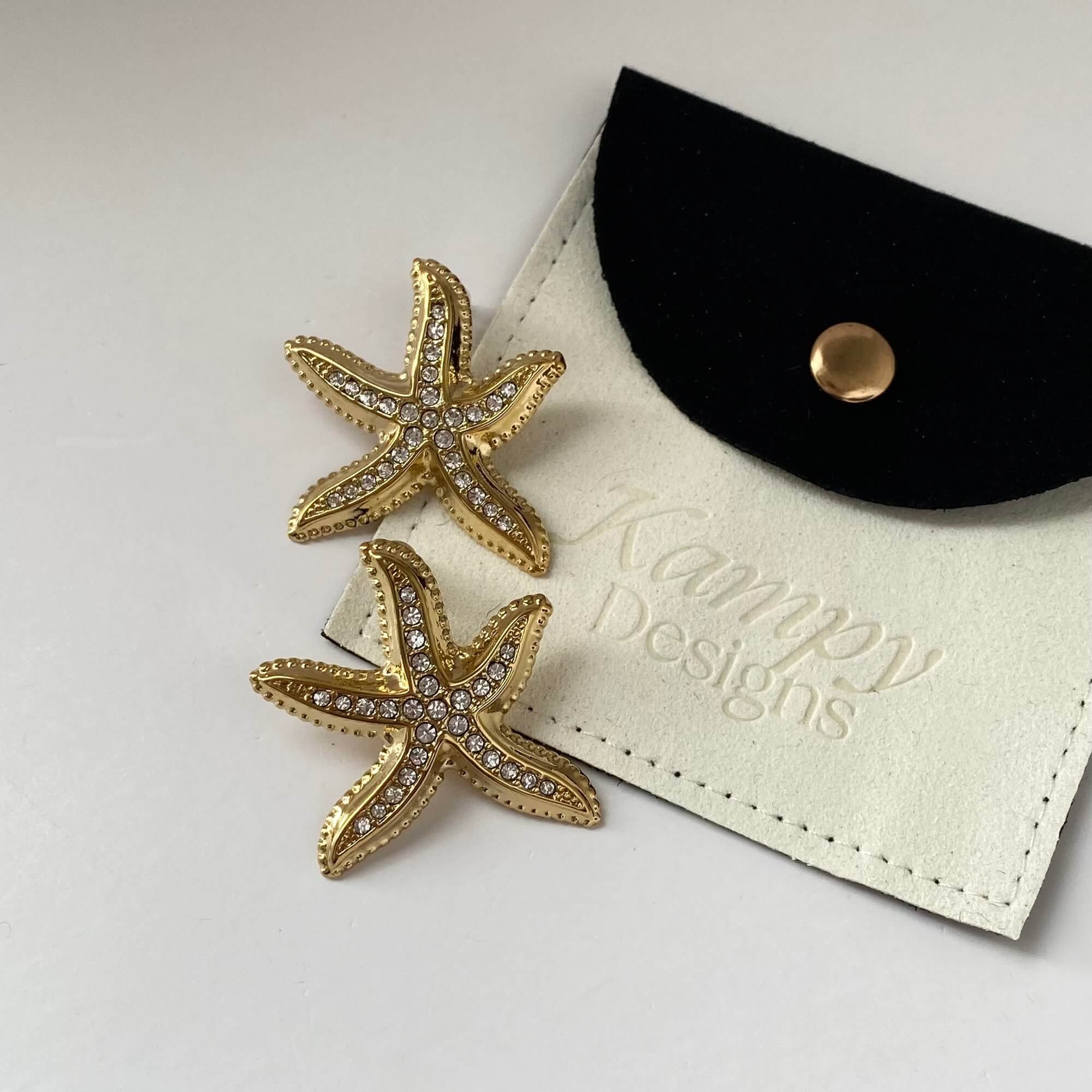 Close-up of the KariyaE pavé starfish earrings by Kampy Designs, highlighting the intricate rhinestone embellishments and bold statement form.