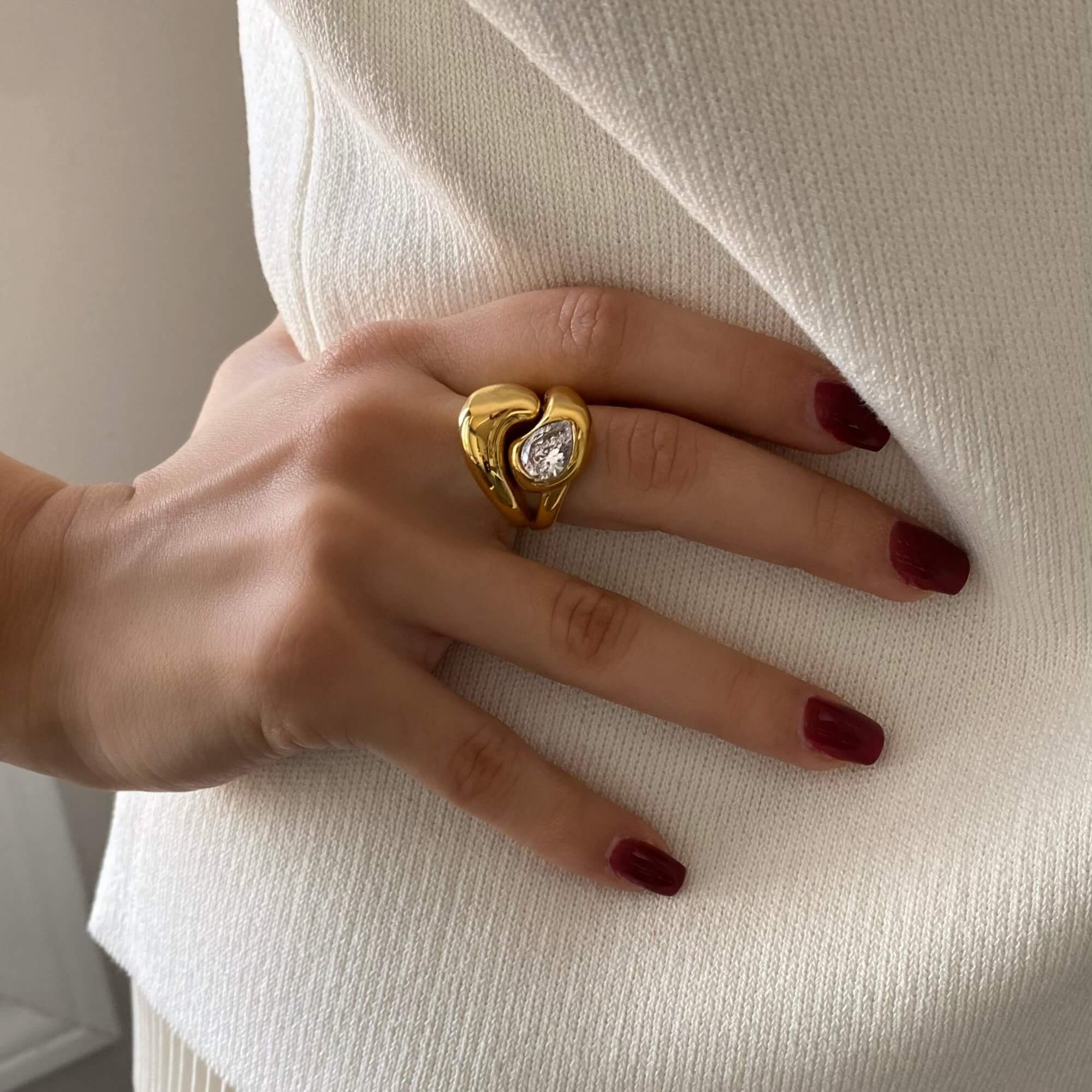 Close-up of the KampyR pear diamond dome ring by Kampy Designs, showcasing intricate details of the dome band and precision-cut pear diamond.