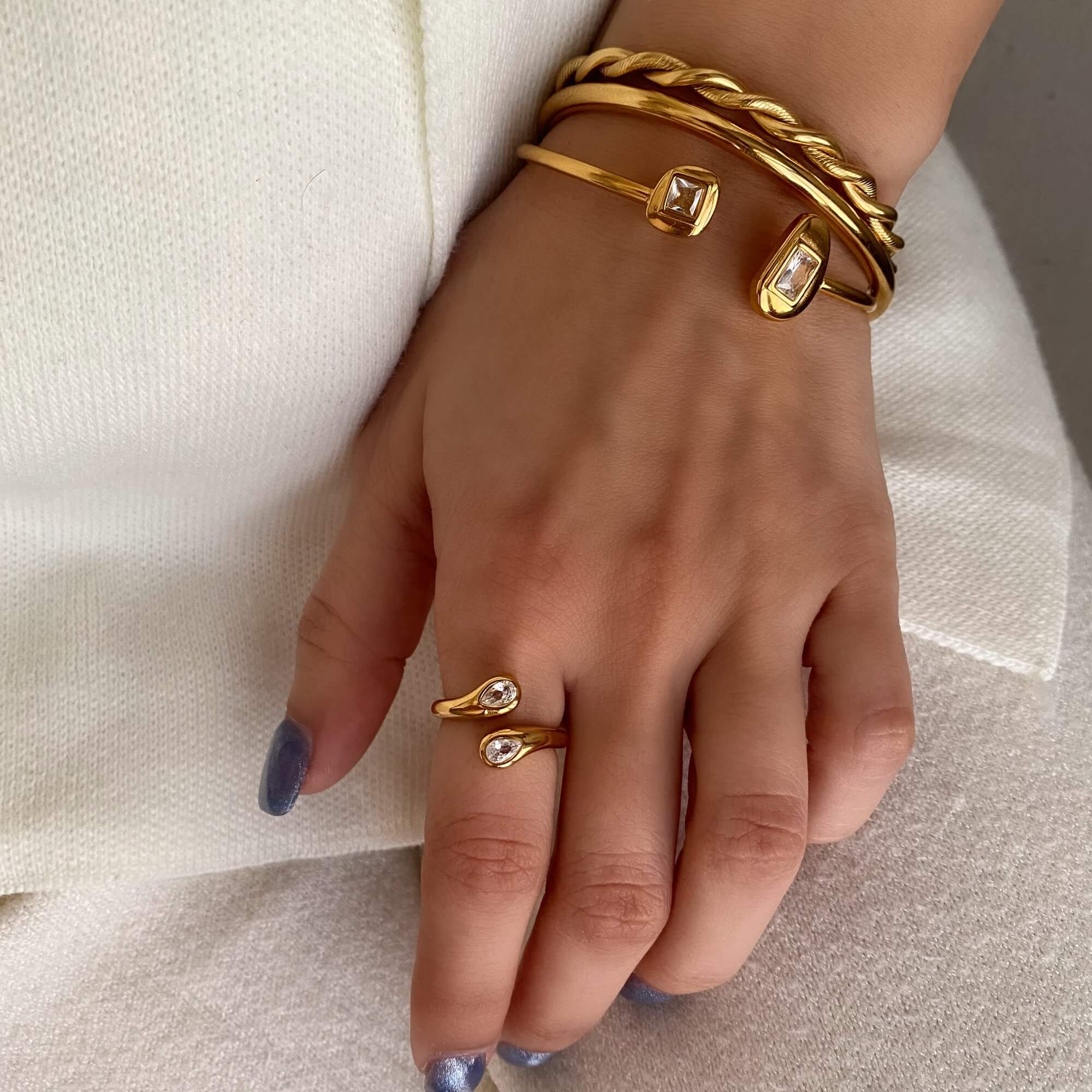 The Kamilar pear wrap ring by Kampy Designs, styled on model to showcase its bold presence and luxurious design in a real-world look.
