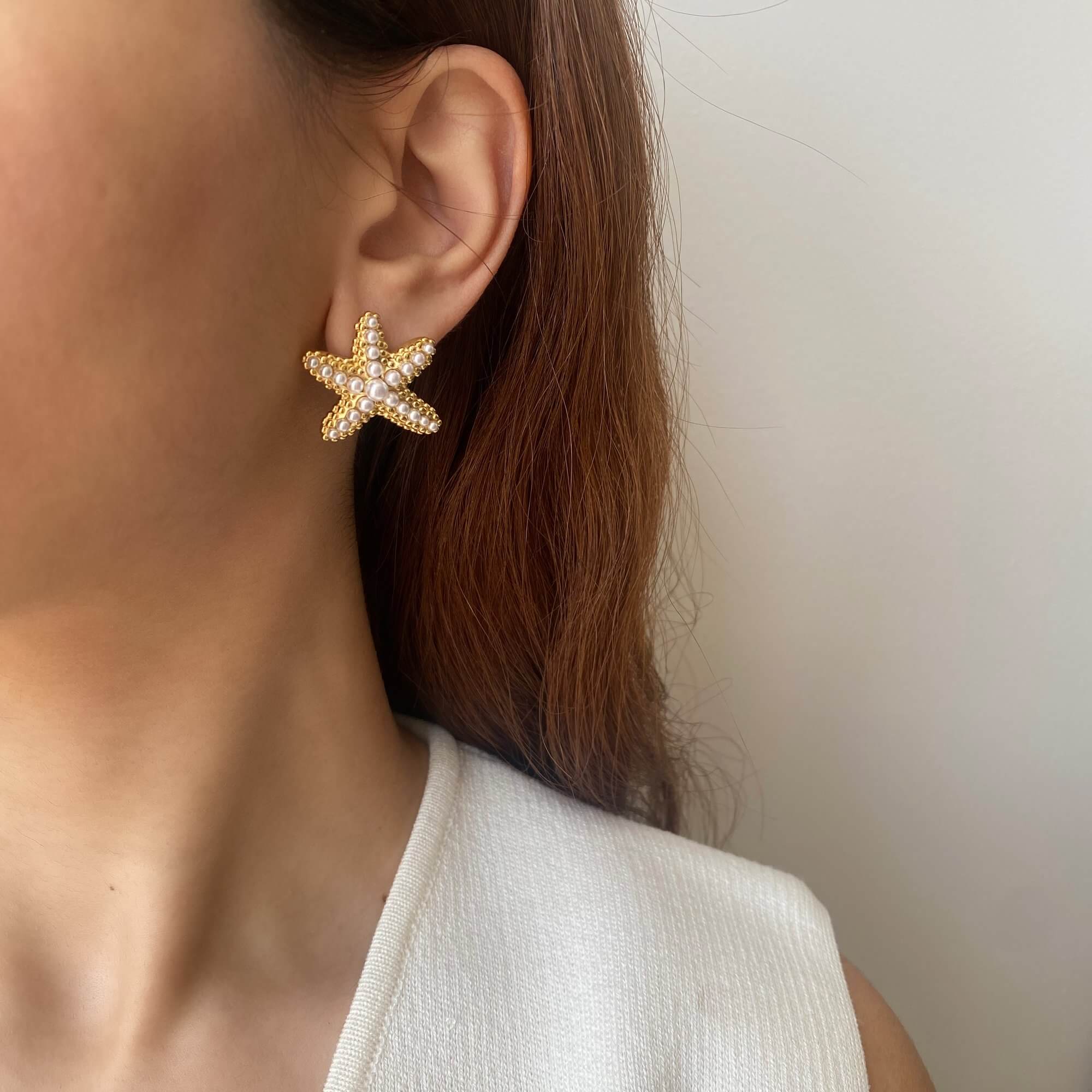 Styled view of KeachyE pearl starfish earrings by Kampy Designs, featured in an ocean-inspired jewelry editorial setting.