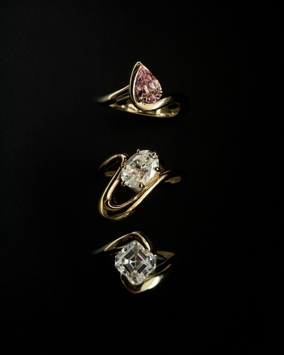 Stacked gold pinky ring ideas with a sculptural wave band design