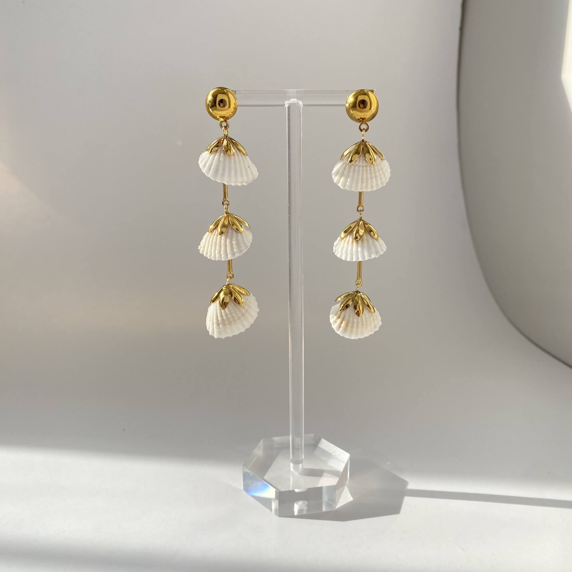 Front view of KlamidyaE real shell dangle earrings by Kampy Designs, displaying their ocean-inspired shape and elegant length.