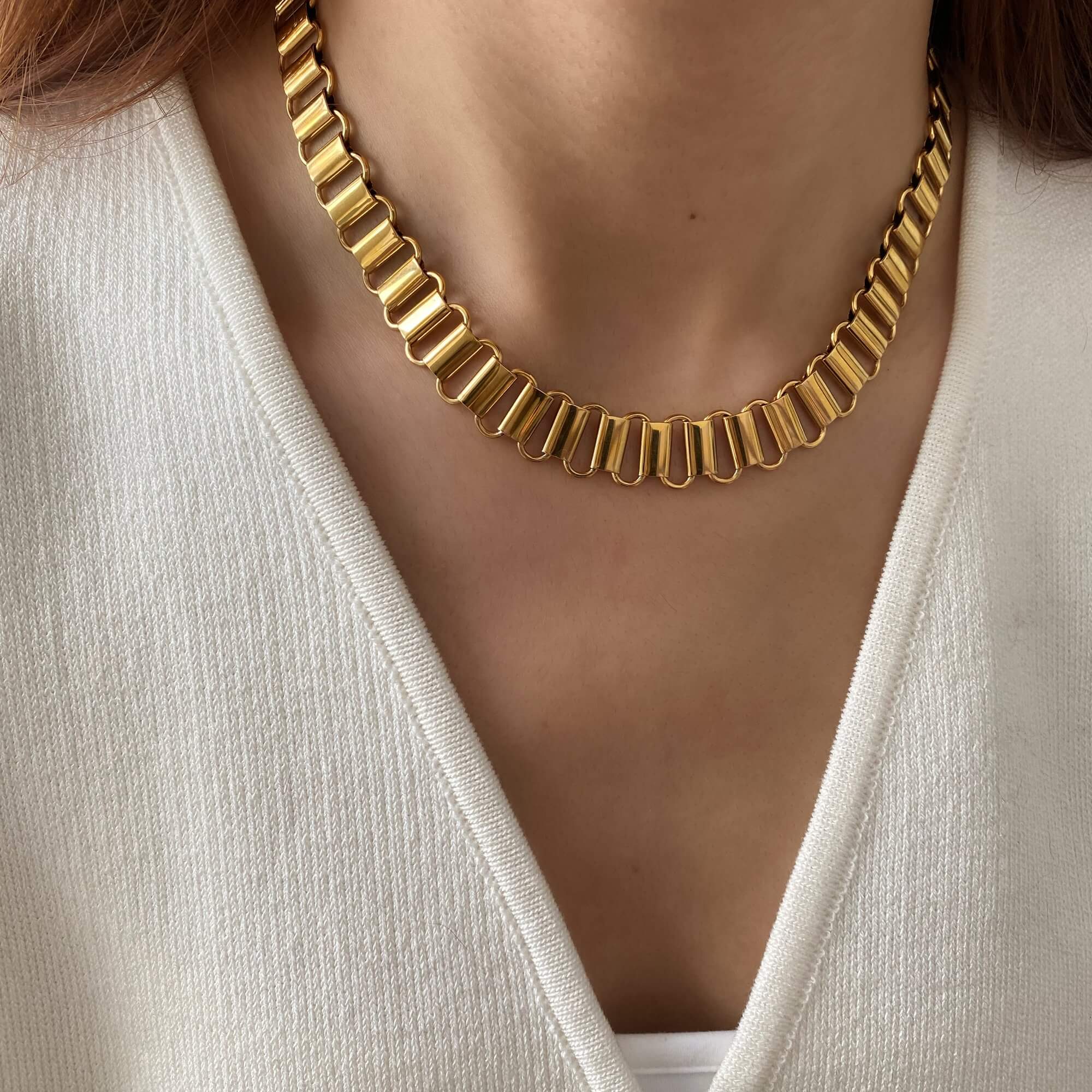 The KlinkyN retro gold chain necklace by Kampy Designs, worn by model to display its bold vintage-inspired links and timeless shine.