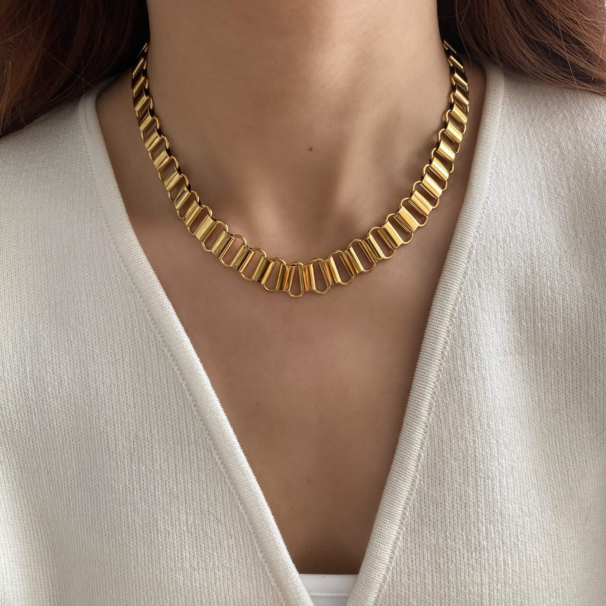 Styled on model, the KlinkyN retro gold chain necklace by Kampy Designs adds a bold vintage statement to any outfit.