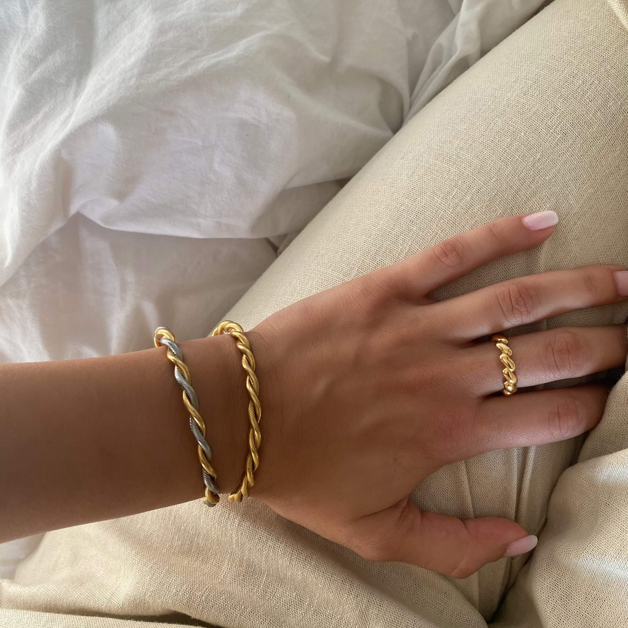 Side view of the KyraB rope twist cuff bracelet in gold and two-toned by Kampy Designs, highlighting its intricate twisted metal design.