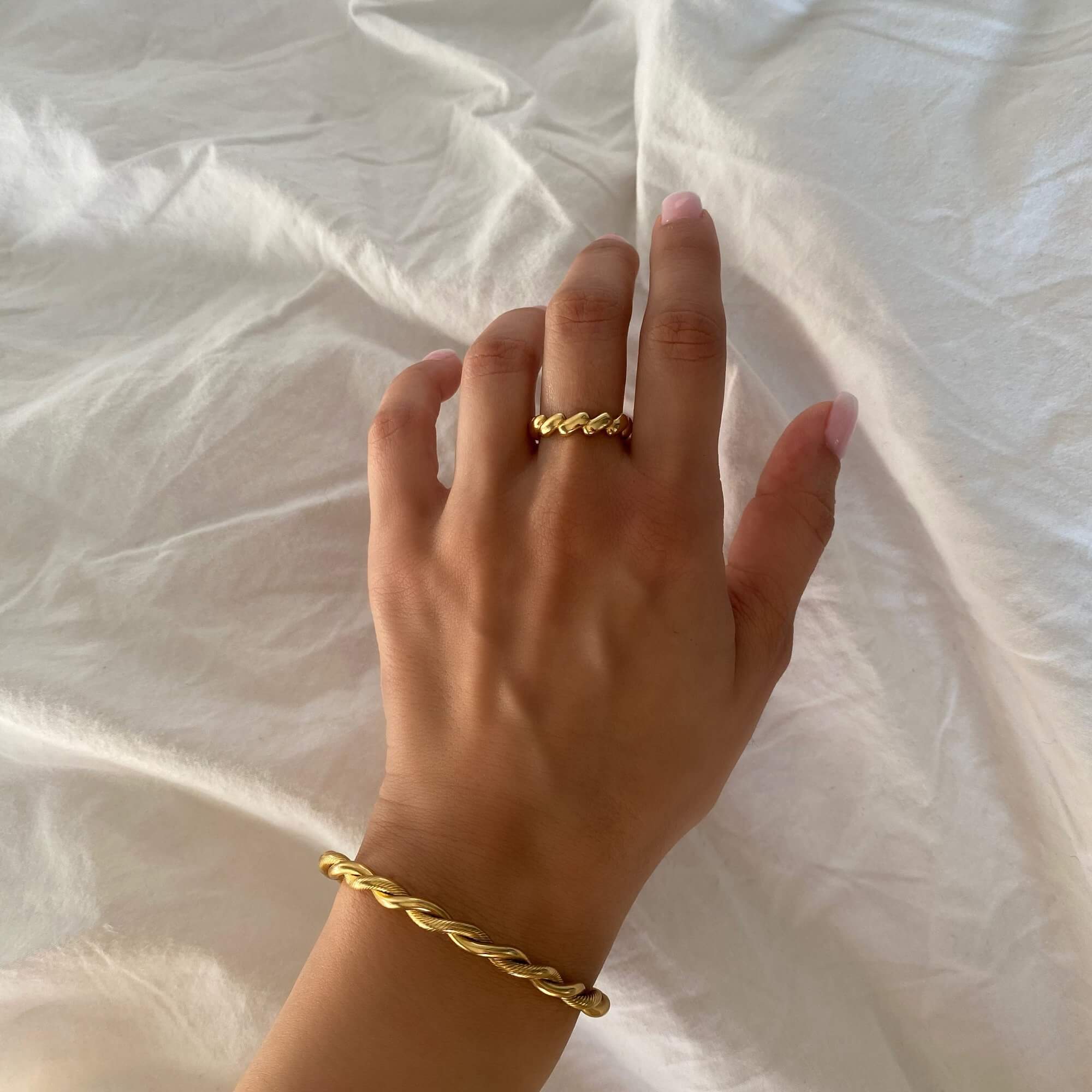 Top view of the KyraB rope twist cuff bracelet in gold and two-toned by Kampy Designs, capturing its bold yet intricate rope texture.