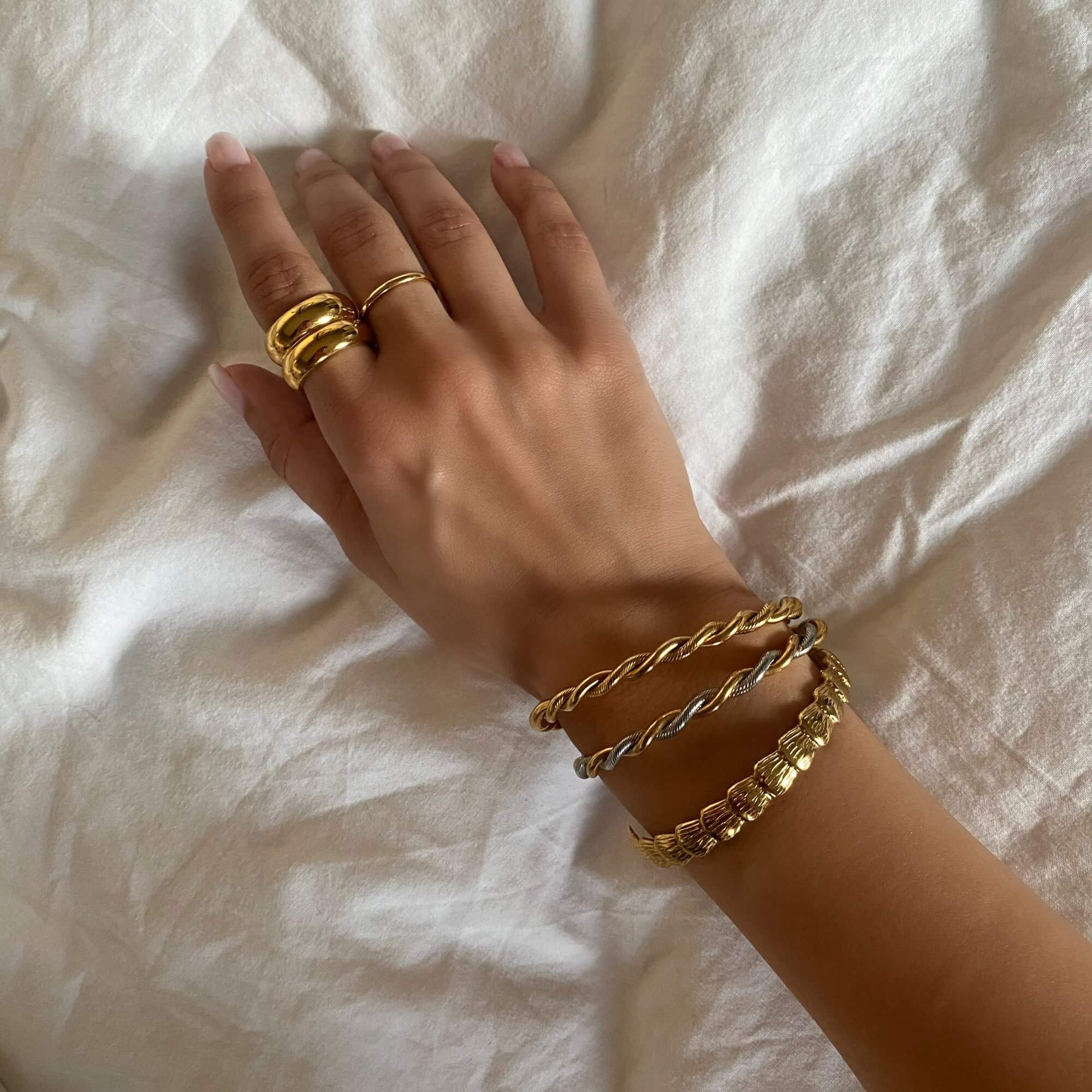 Alternative top view of the KyraB rope twist cuff bracelet in gold and two-toned by Kampy Designs, showcasing its twisted metal details and smooth finish.