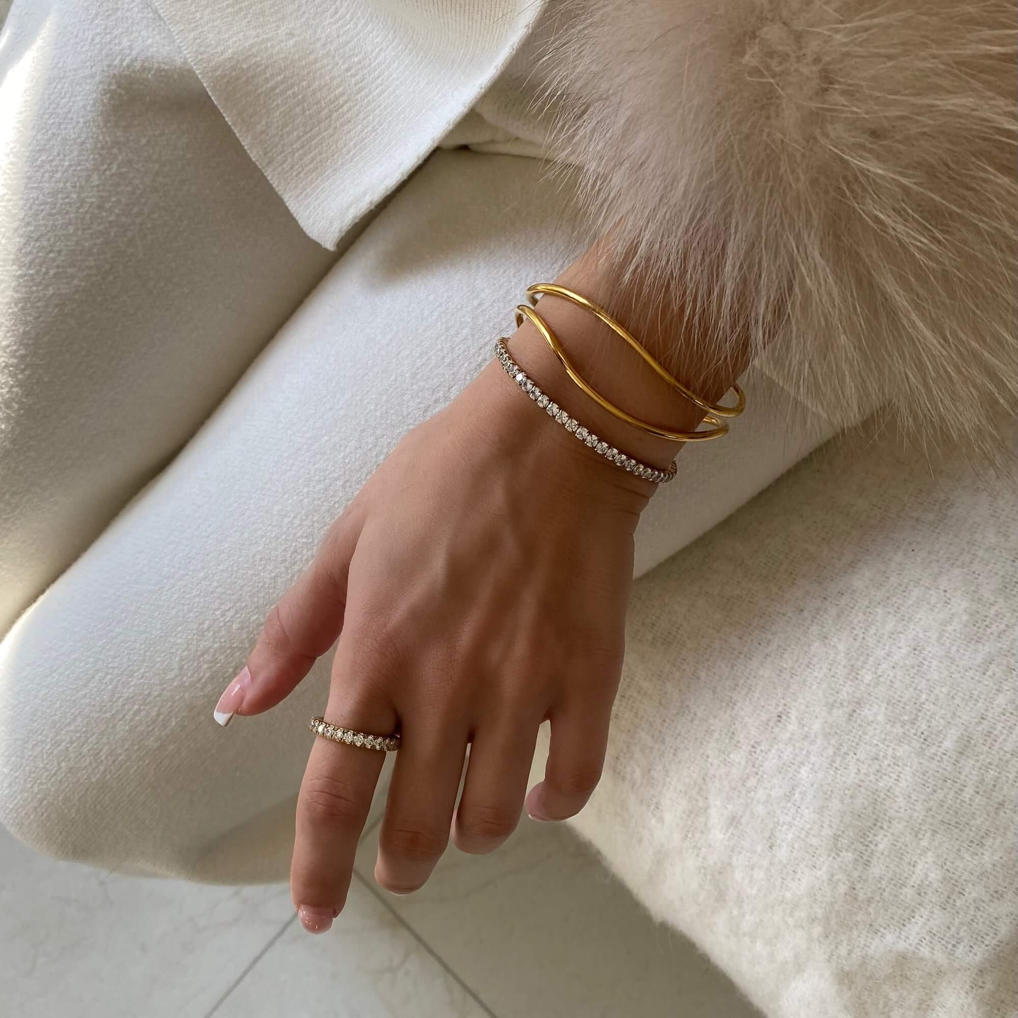 The KowR round diamond eternity band ring by Kampy Designs, styled to complement a sophisticated and timeless jewelry ensemble.