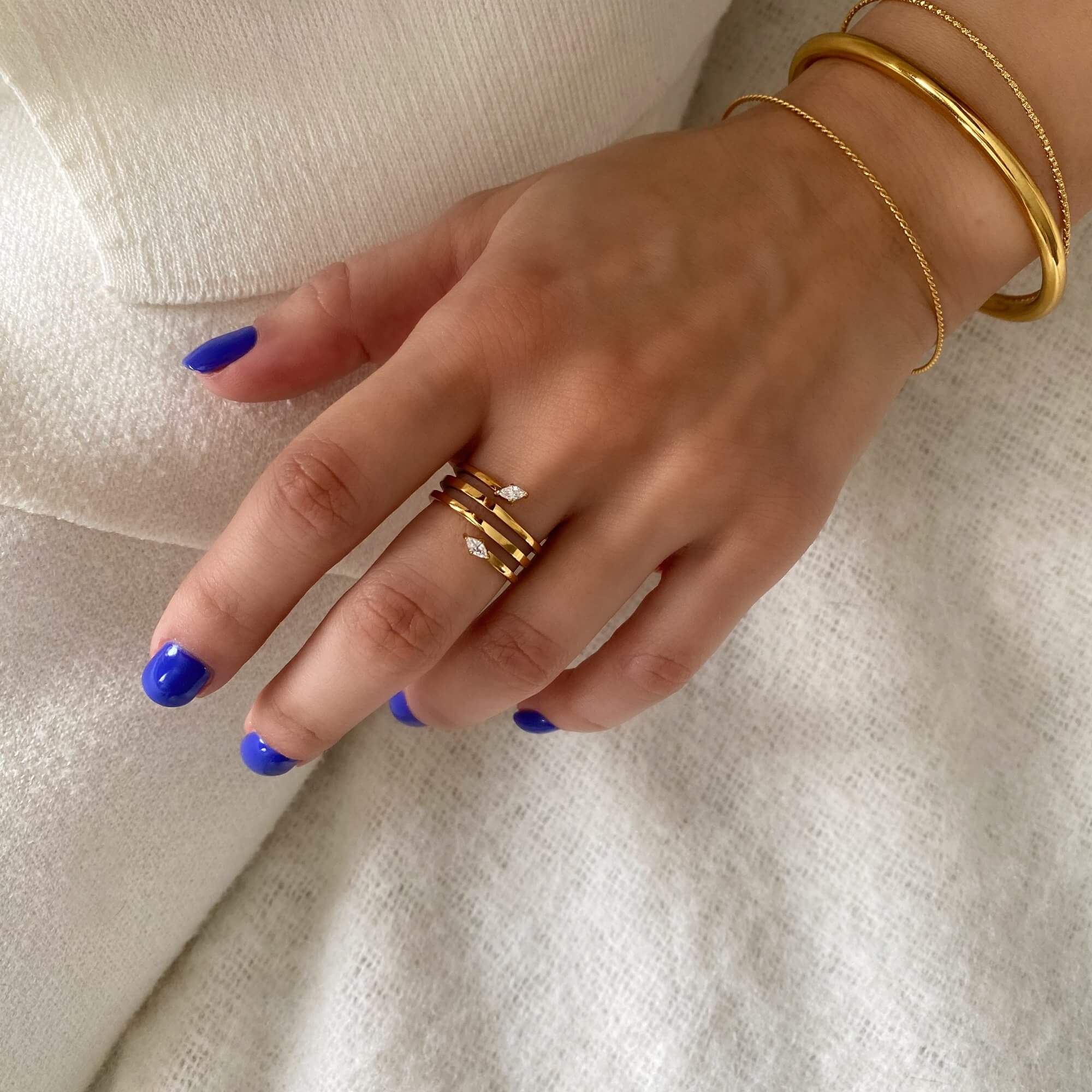Angled shot of the Kinor serpentine wrap ring by Kampy Designs, worn by model for a stylish and edgy look.
