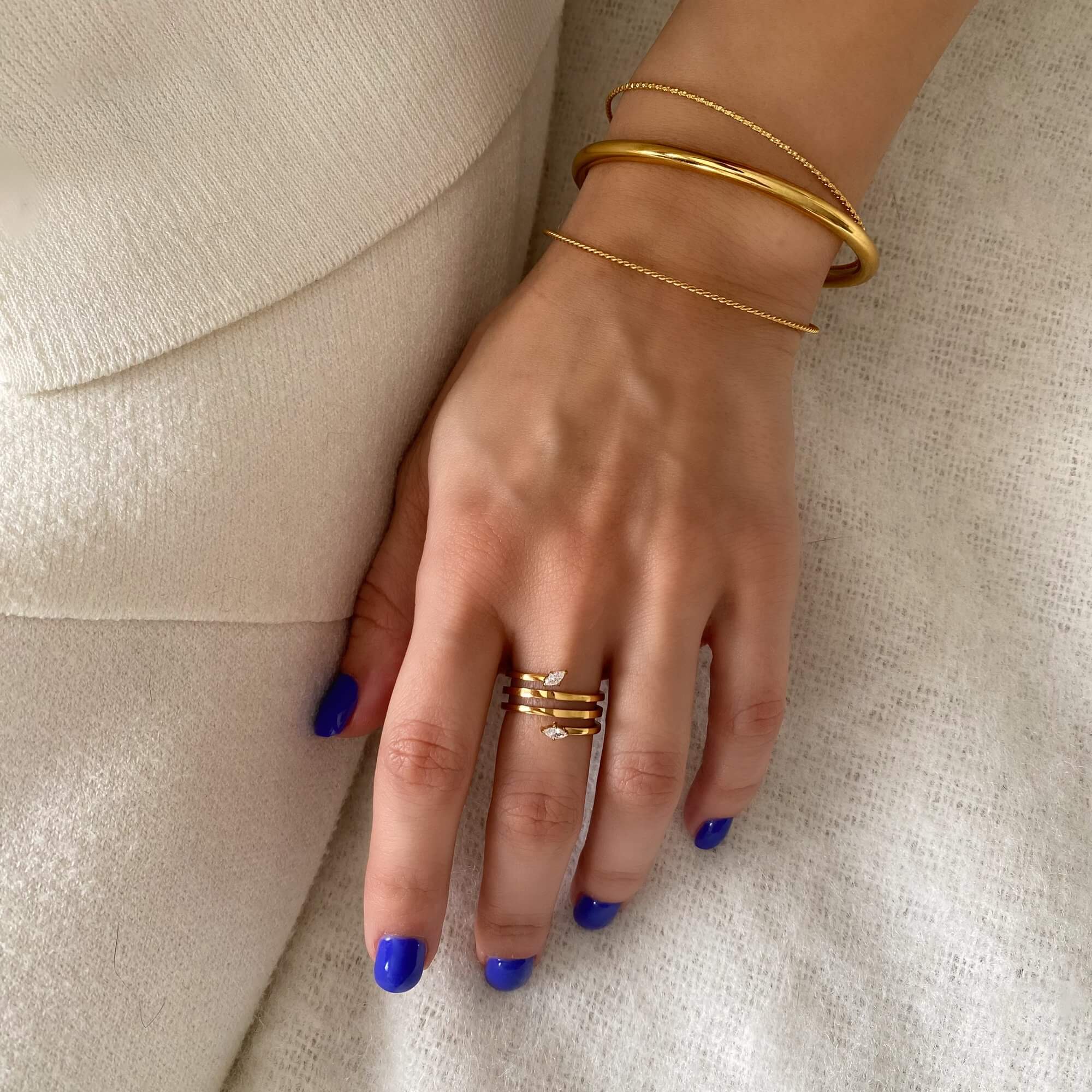 Styled view of the Kinor serpentine wrap ring by Kampy Designs, worn on the model’s hand to display its coiled elegance and bold silhouette.