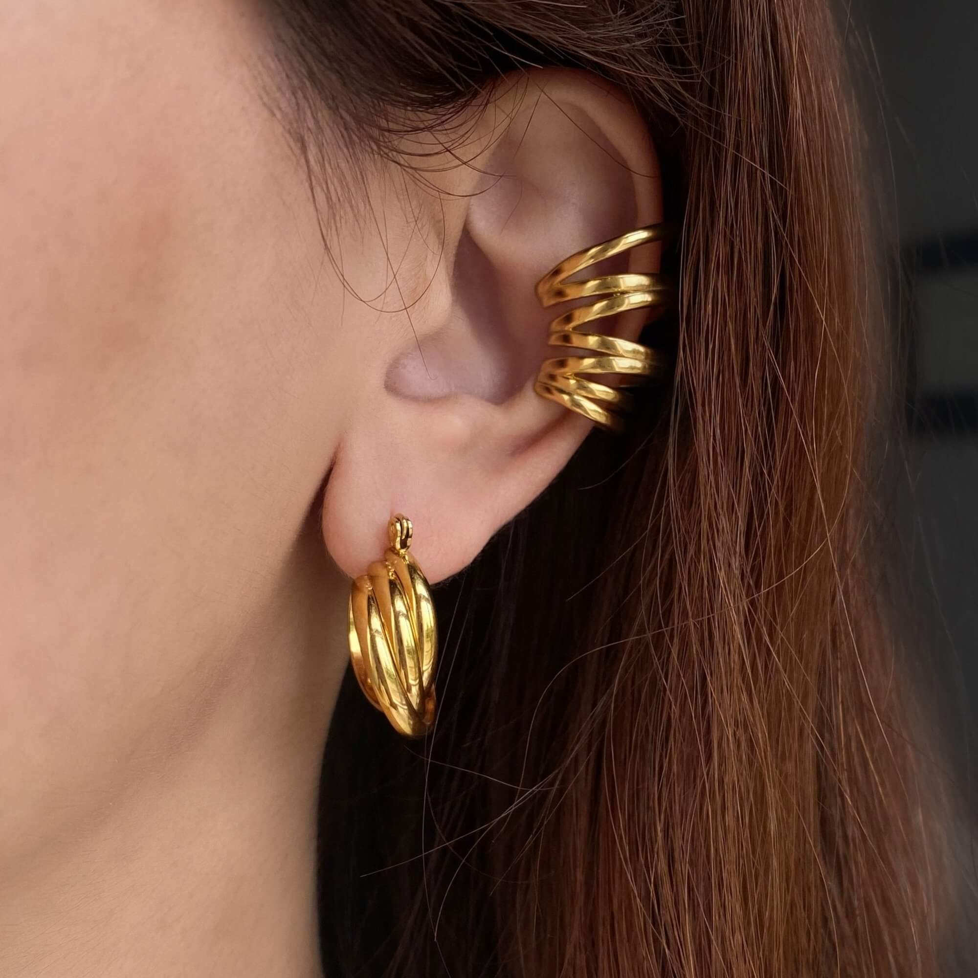 The KanaE stacked hoop ear cuff by Kampy Designs, styled with other jewelry pieces for a bold and modern ear accessory look.