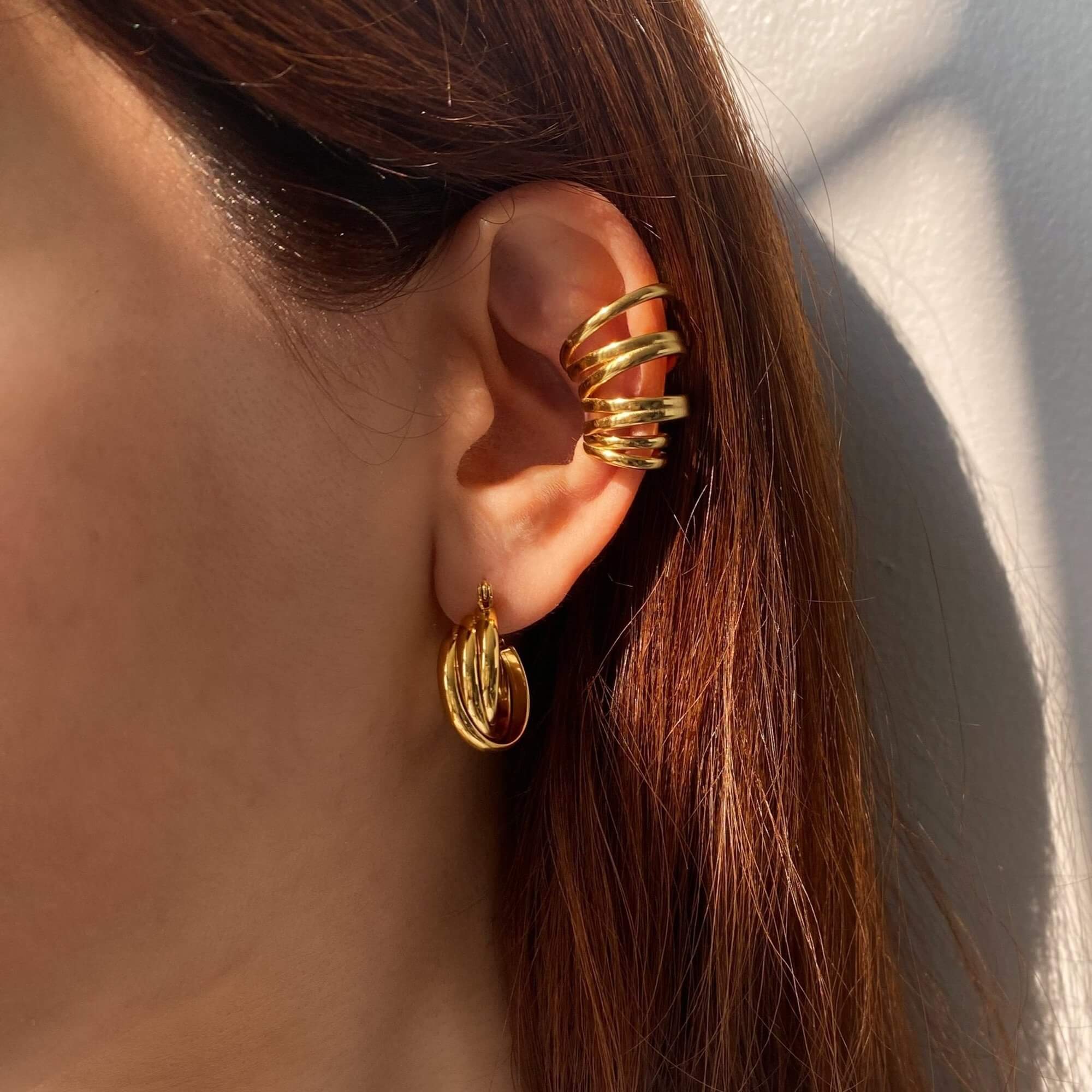 The KanaE stacked hoop ear cuff by Kampy Designs, beautifully worn to highlight its layered structure and elegant, contemporary appeal.