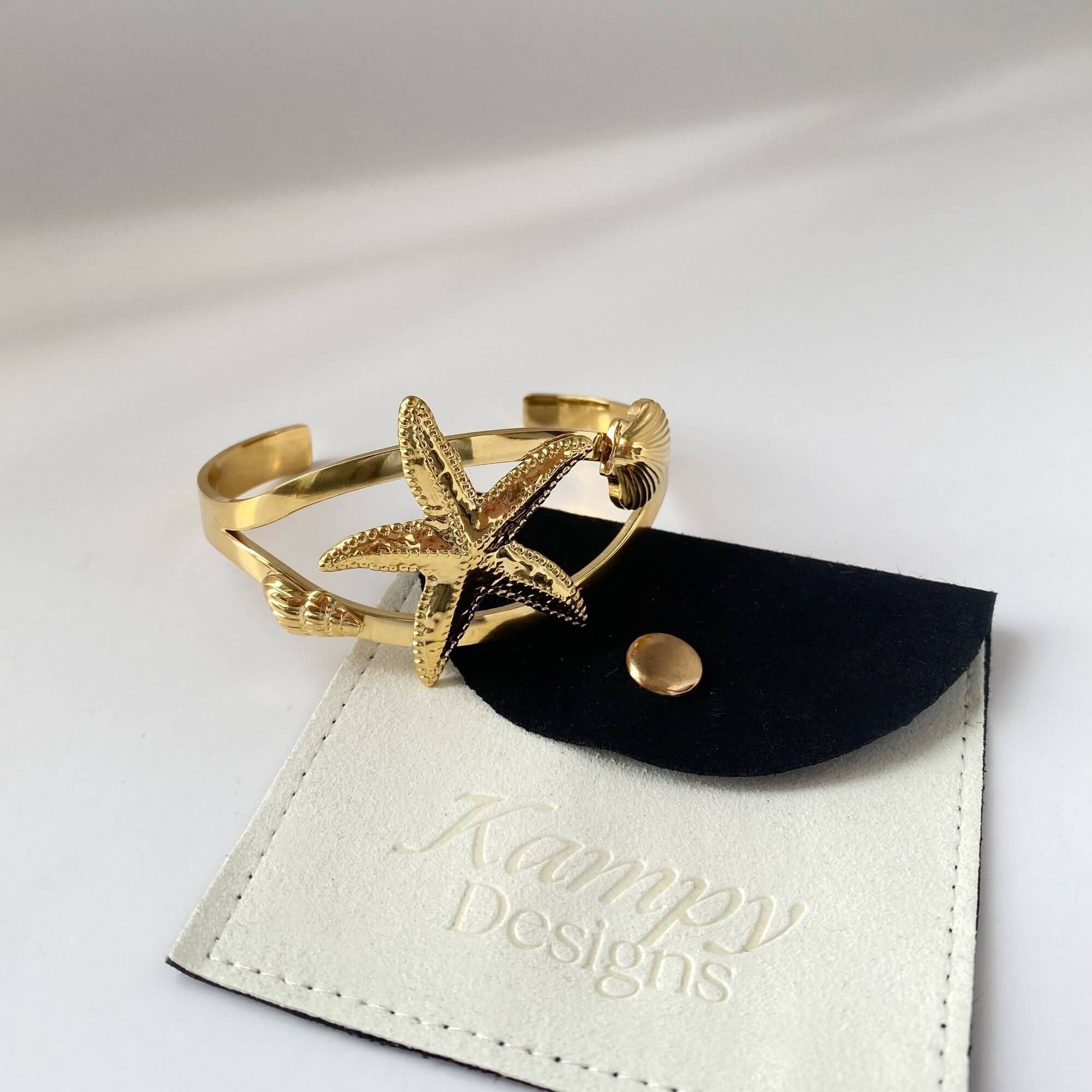 Branded flat lay of the KoralB starfish cuff bracelet by Kampy Designs, artistically styled to reflect oceanic elegance and quality craftsmanship.