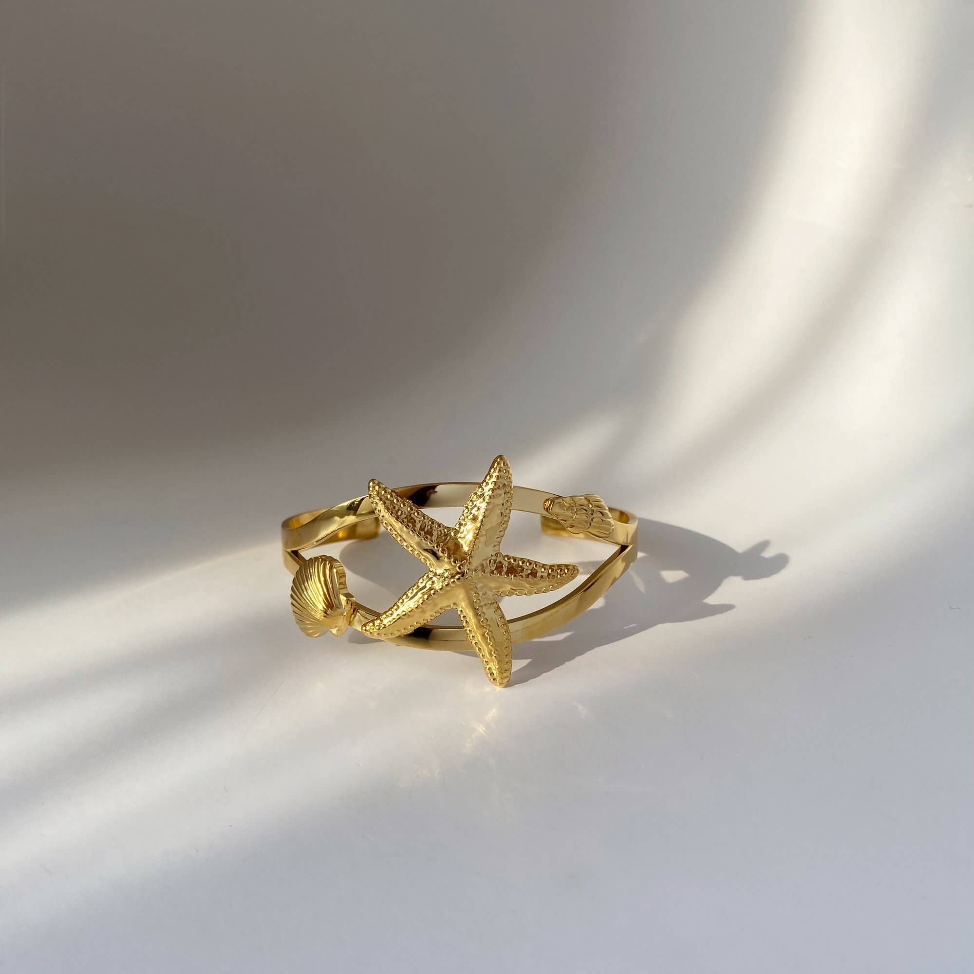 Side view of the KoralB starfish cuff bracelet by Kampy Designs, featuring its curved shape and intricate starfish detailing.