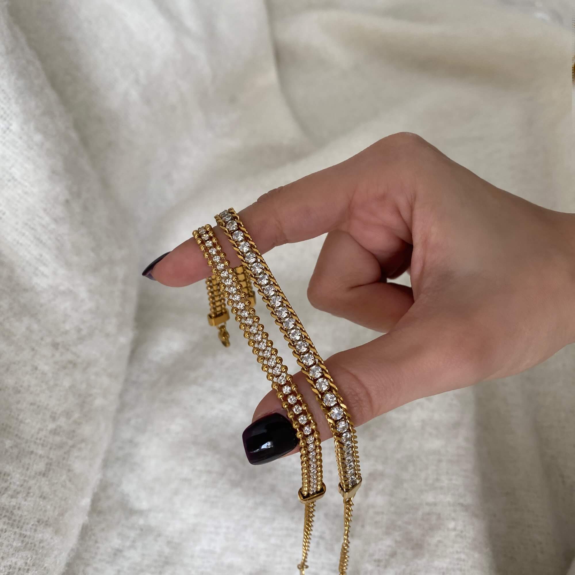 Angled view of the KaperB tennis chain bracelet by Kampy Designs, highlighting its elegant curve and shimmering details.