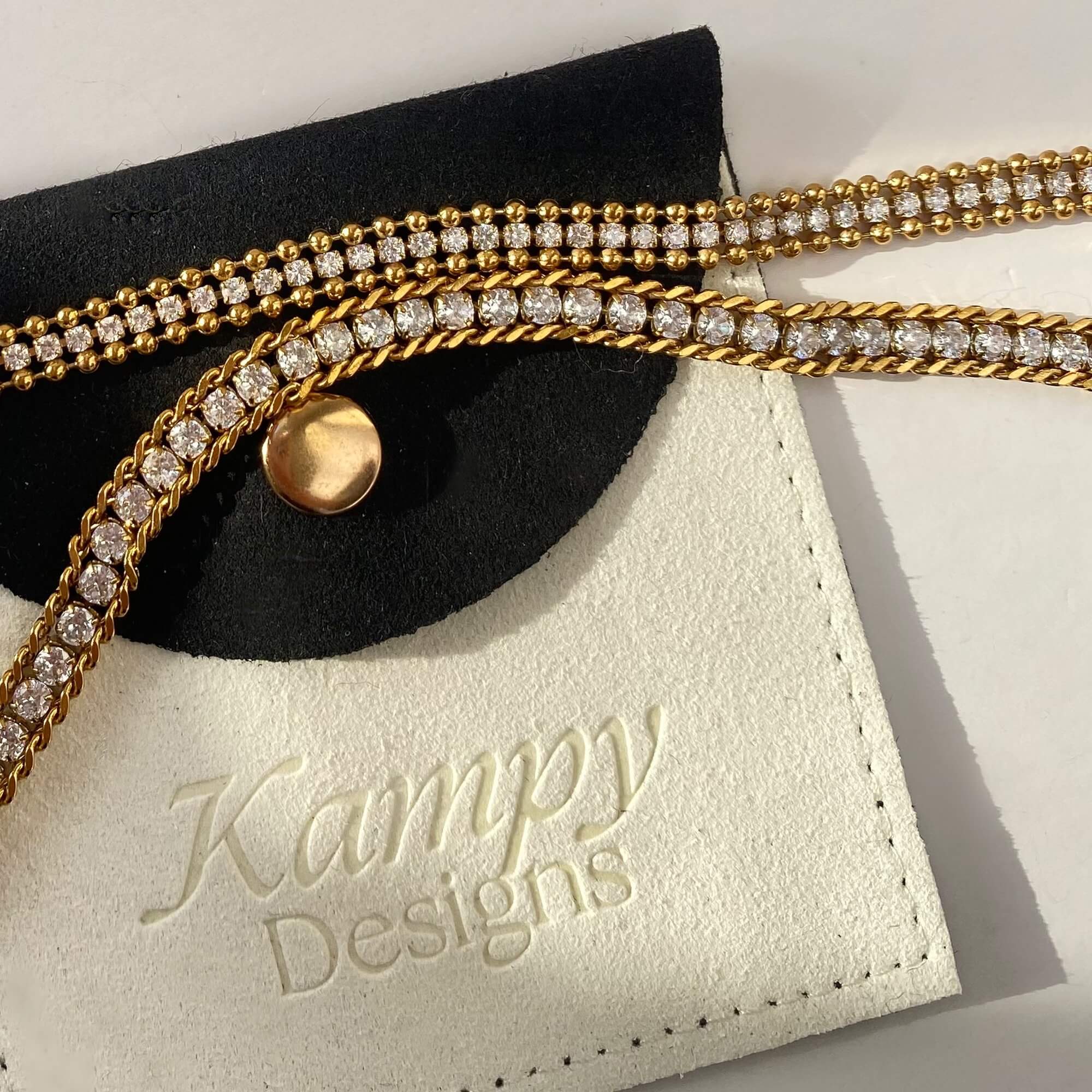 Branded flat lay of the KaperB tennis chain bracelet by Kampy Designs, perfectly presented with the Kampy logo and luxurious appeal.