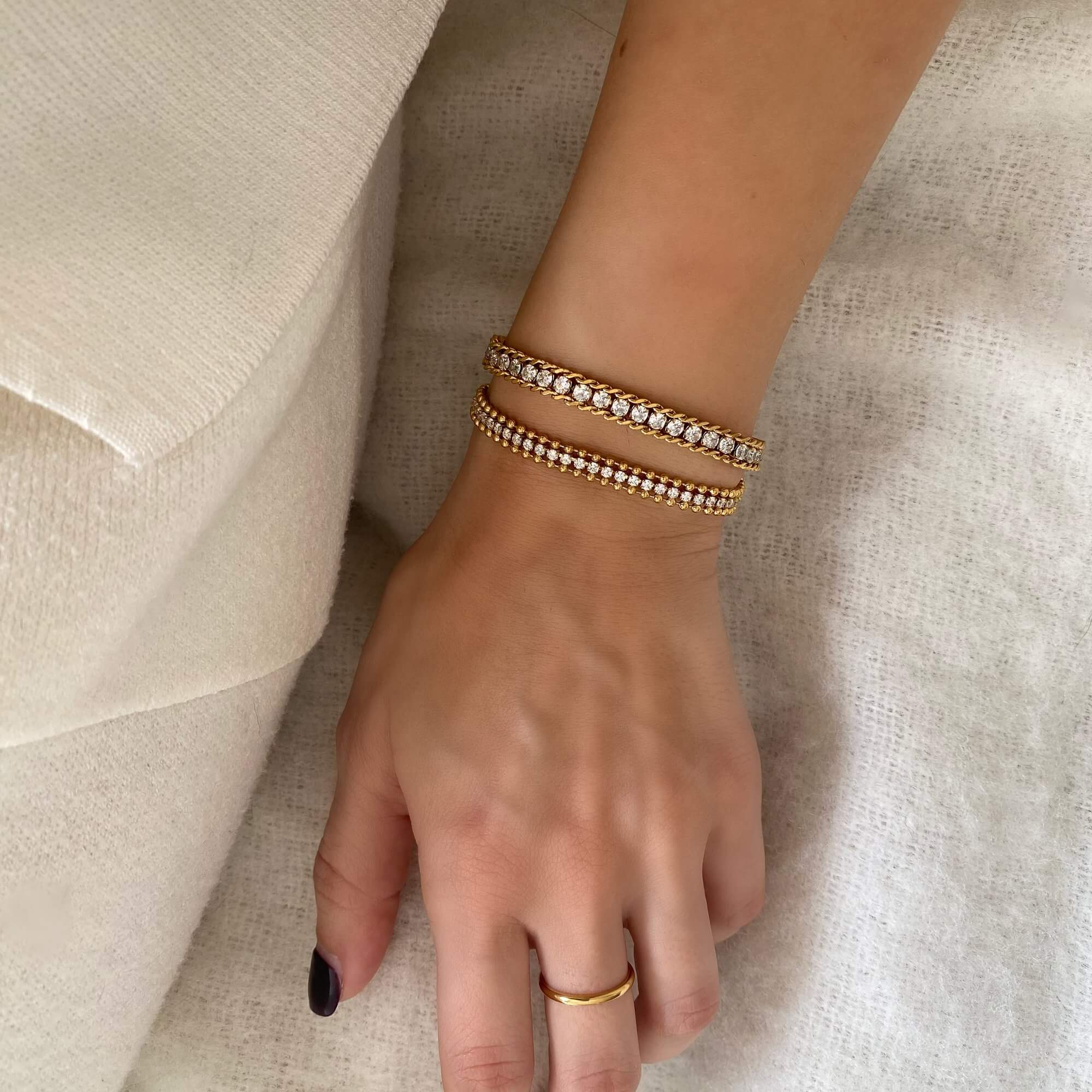 The KaperB tennis chain bracelet by Kampy Designs, shown on the wrist for a graceful fit and glamorous appearance.